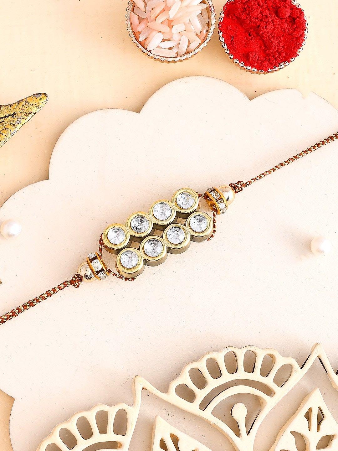 

Aapno Rajasthan Beaded Thread Rakhi with Roli Chawal & Greetings Card, Gold