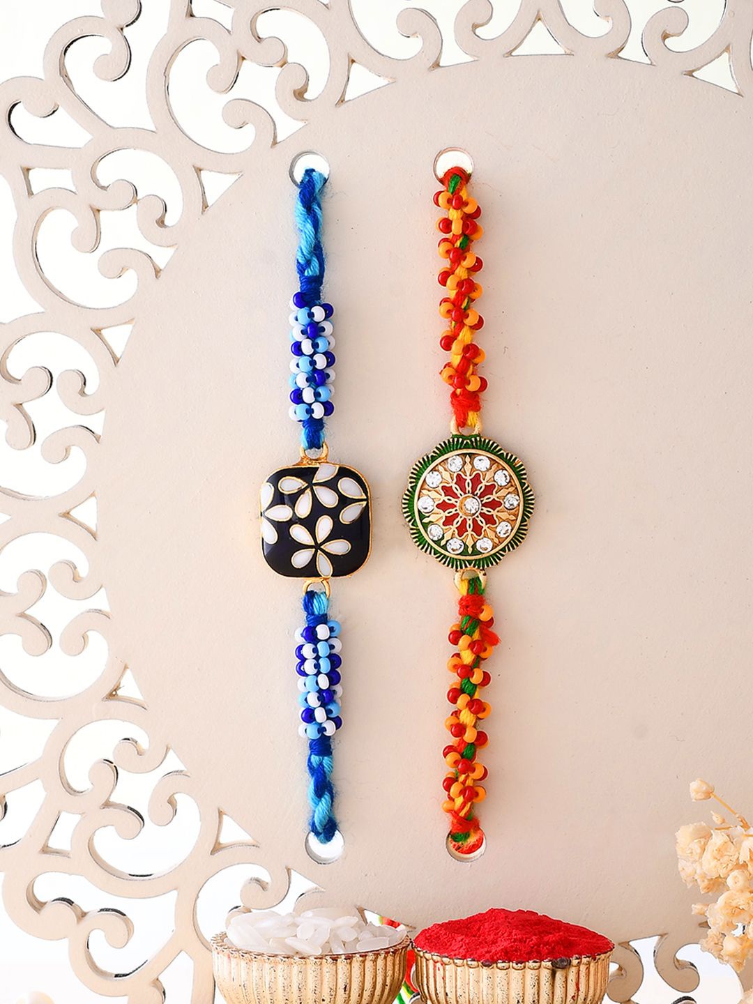 

Aapno Rajasthan Set Of 2 Stone Studded & Beaded Rakhis With Roli Chawal & Greeting Card, Blue