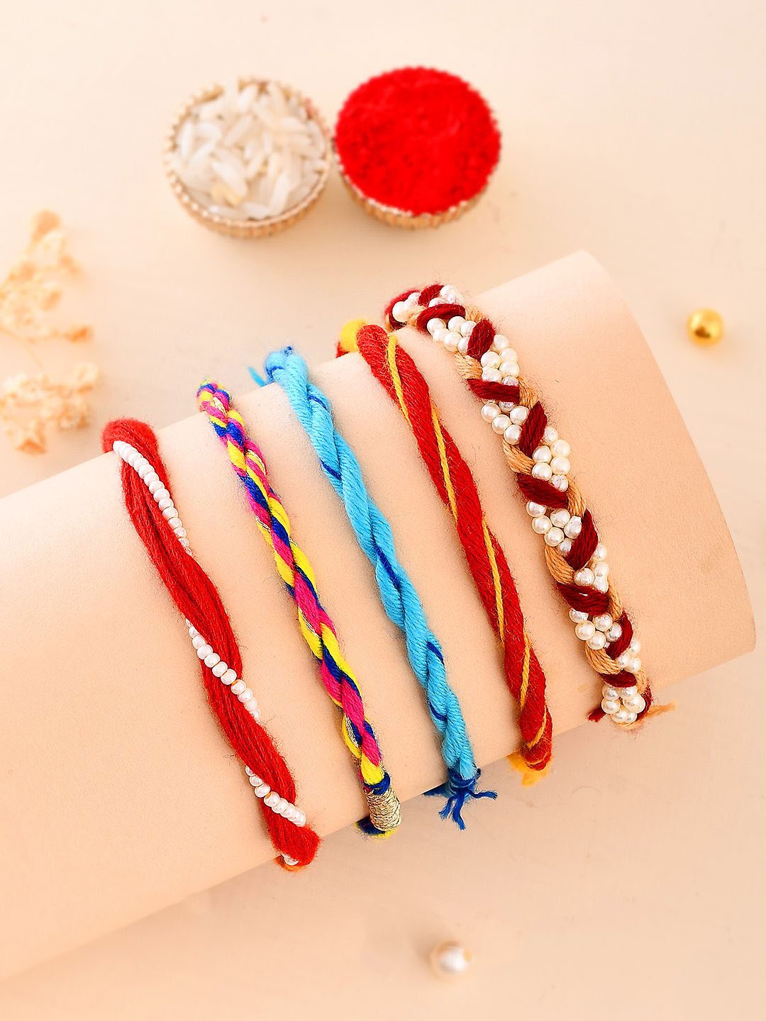 

Aapno Rajasthan Set Of 5 Beaded Rakhis With Roli Chawal & Greeting Card, Red
