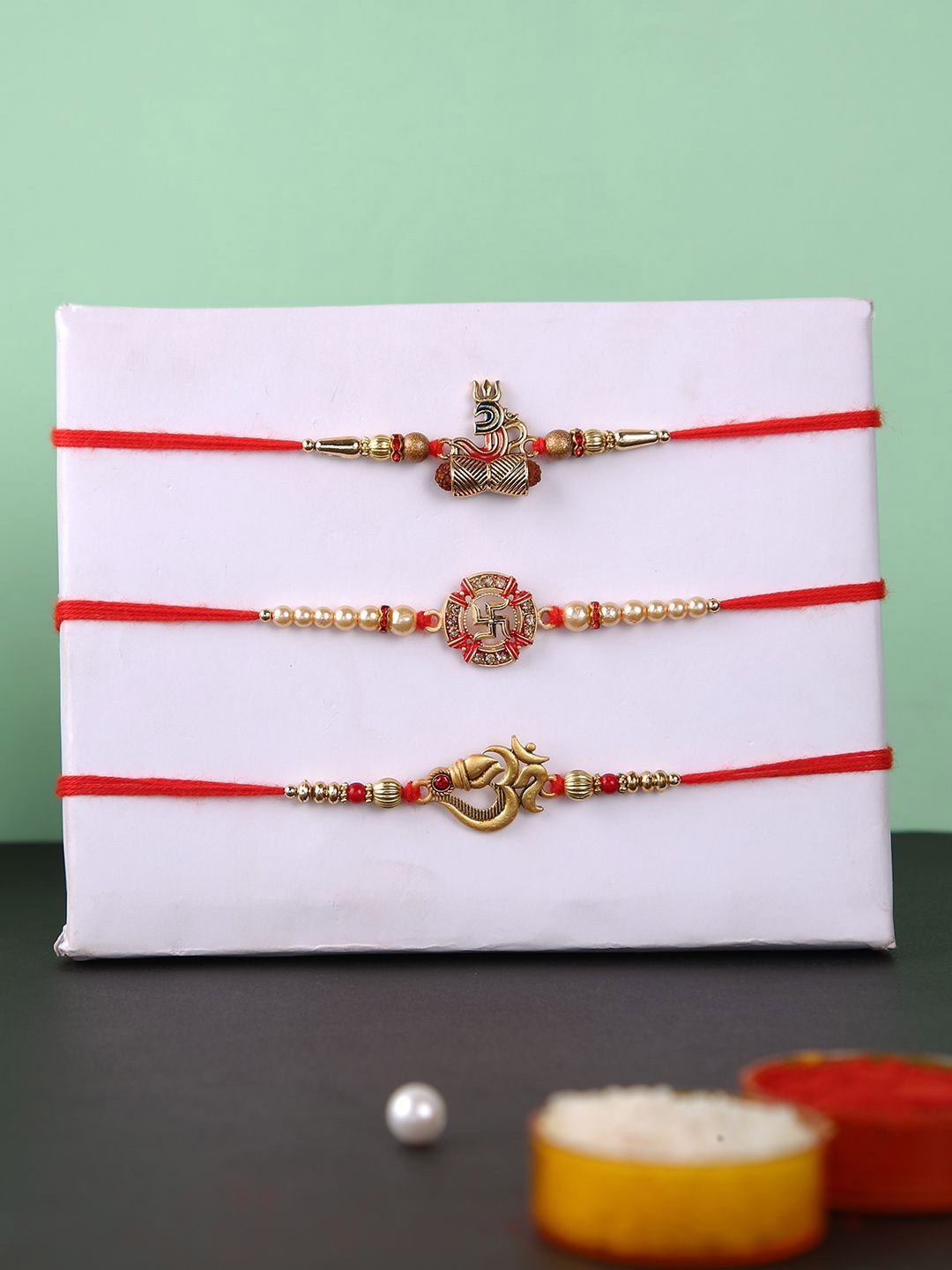 

Aapno Rajasthan Set of 3 Om and Swastika Beaded Rakhi with Roli Chawal, Gold
