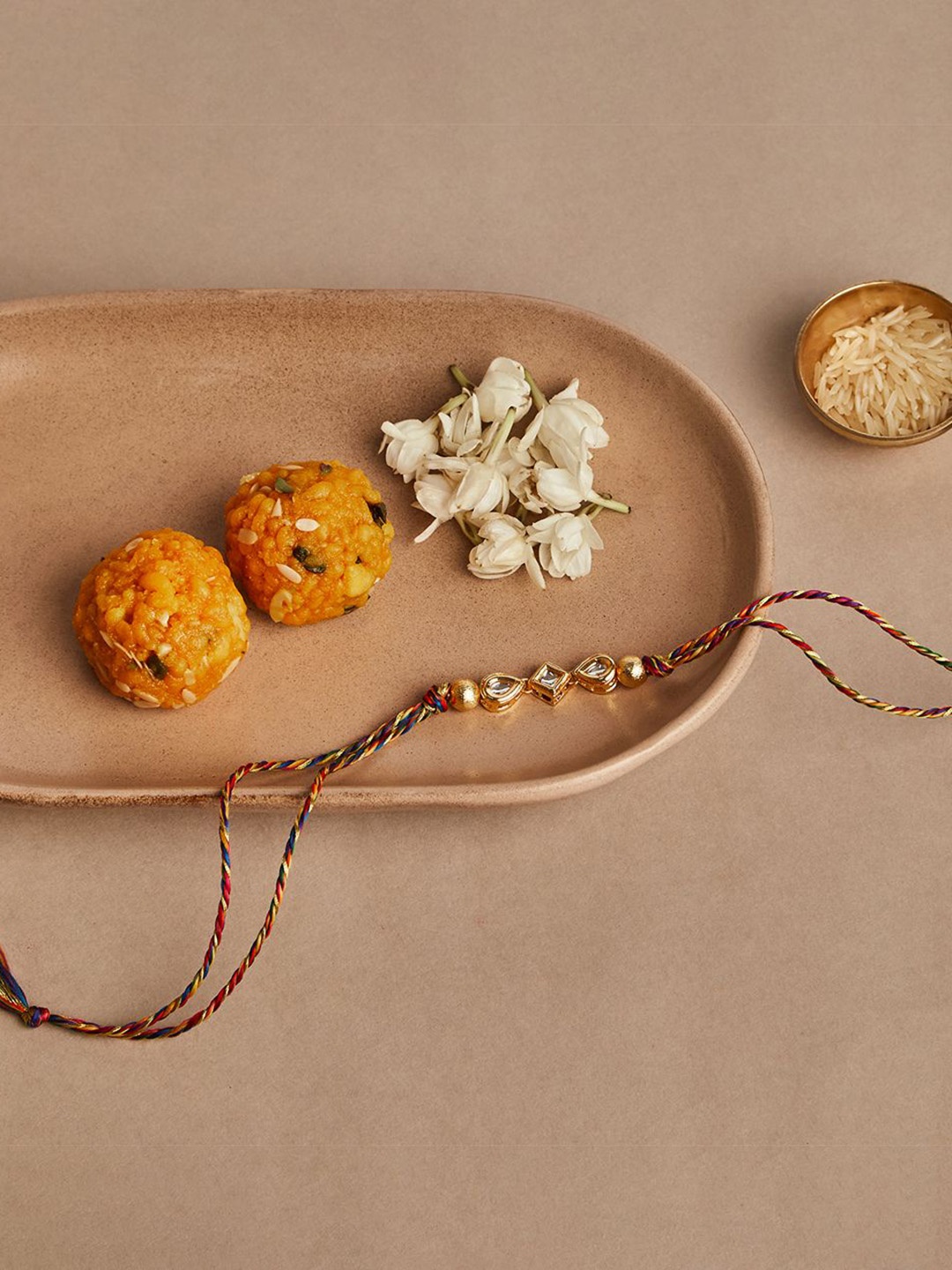 

Fabindia Tie-Up Thread Rakhi, Gold