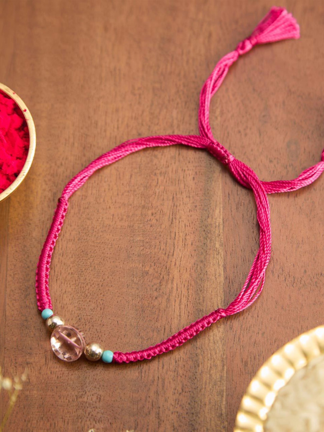 

Fabindia Beaded Thread Rakhi With Roli Chawal, Pink
