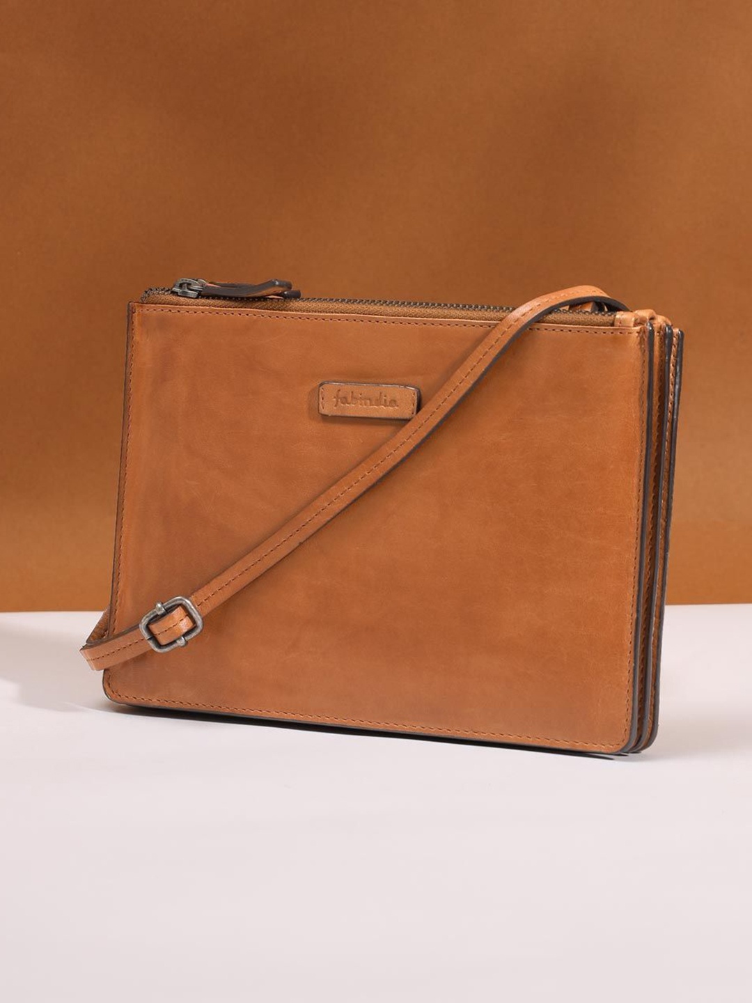

Fabindia Leather Structured Sling Bag with Tasselled, Brown