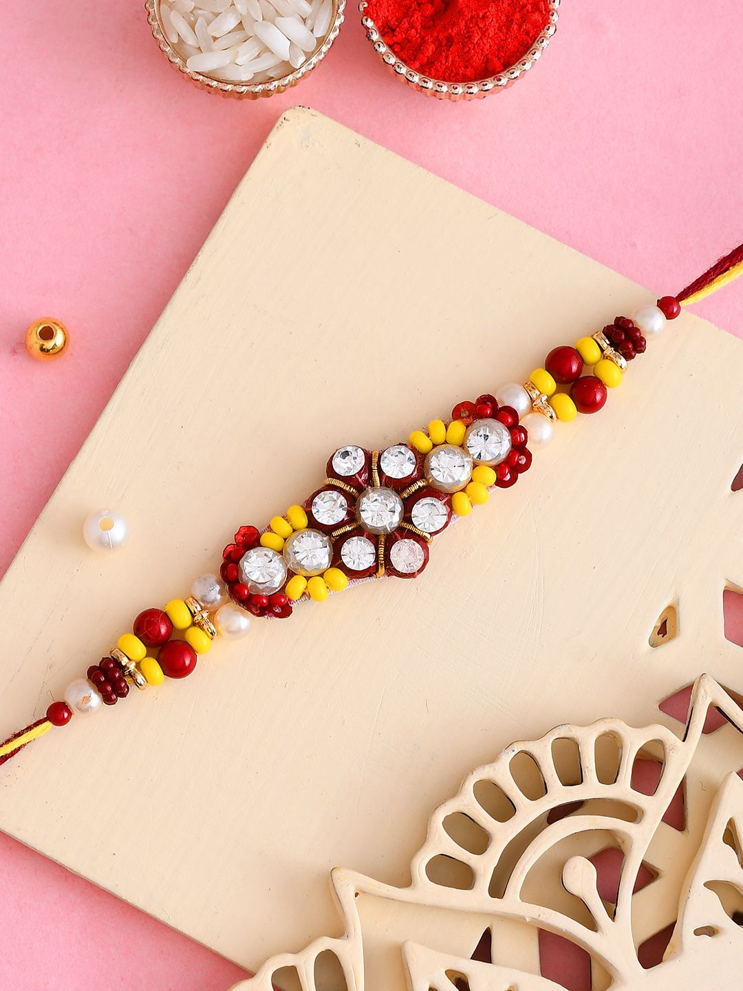 

Aapno Rajasthan Stone-Studded & Beaded Thread Rakhi, Yellow