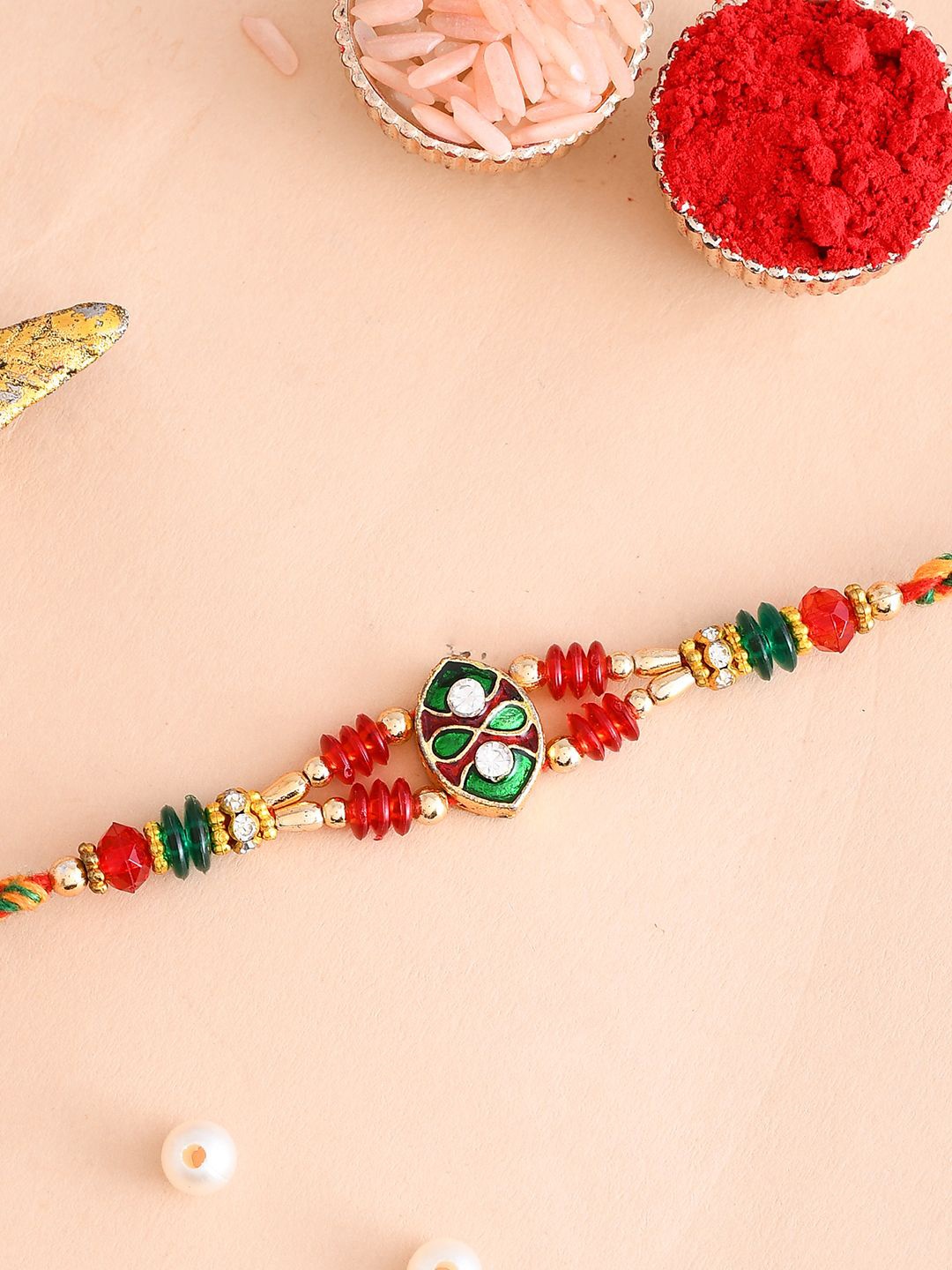 

Aapno Rajasthan Crystal Beaded Meenakari Work Rakhi With Roli Chawal & Greetings Card, Red