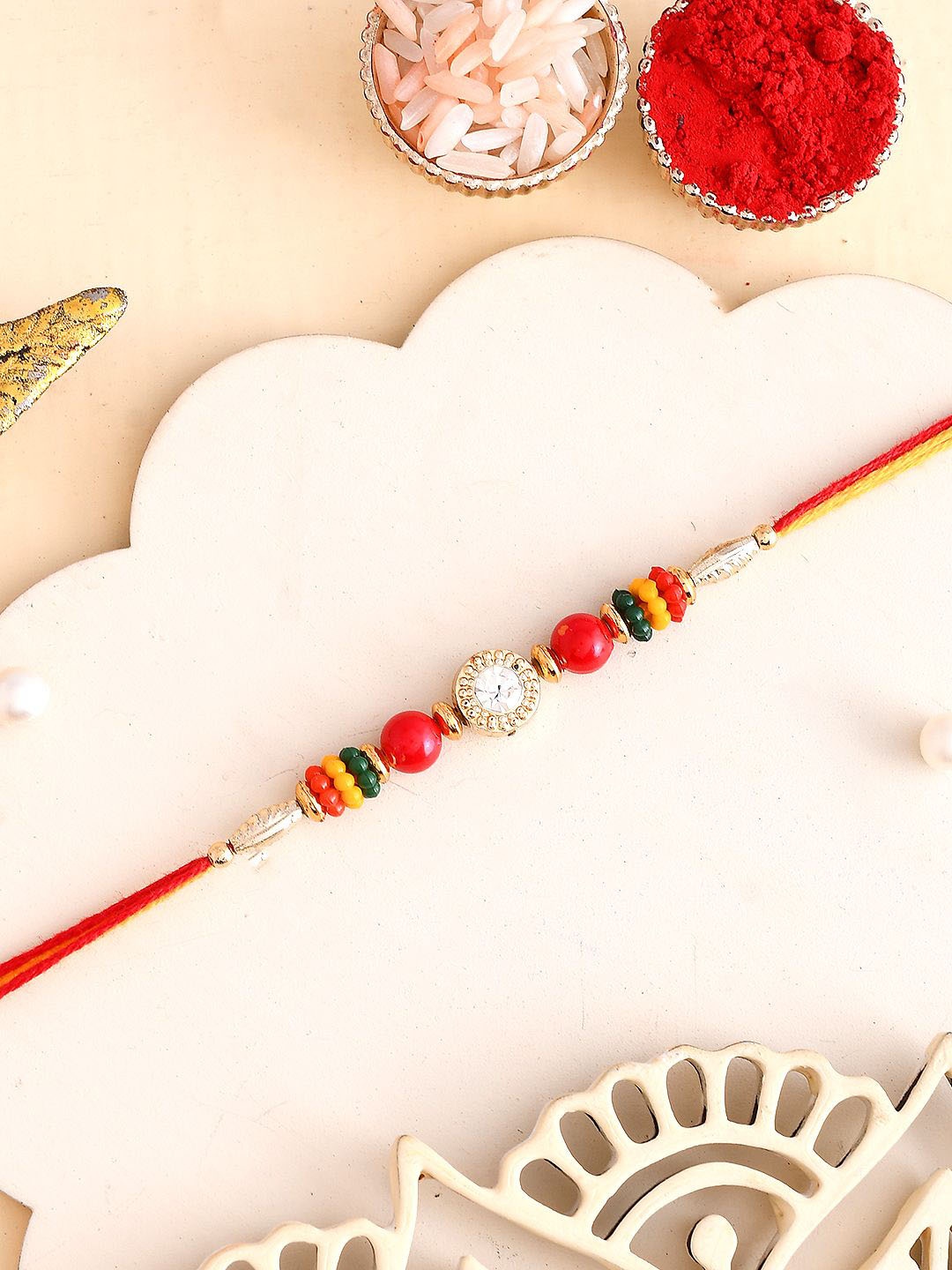 

Aapno Rajasthan Stone-Studded & Beaded Thread Rakhi, Red