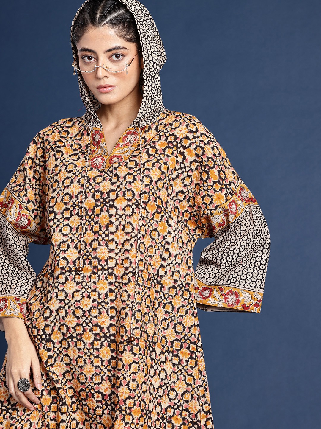 

Taavi Kalamkari Indie Floral Printed Hooded A-Line Pure Cotton Ethnic Dress, Multi