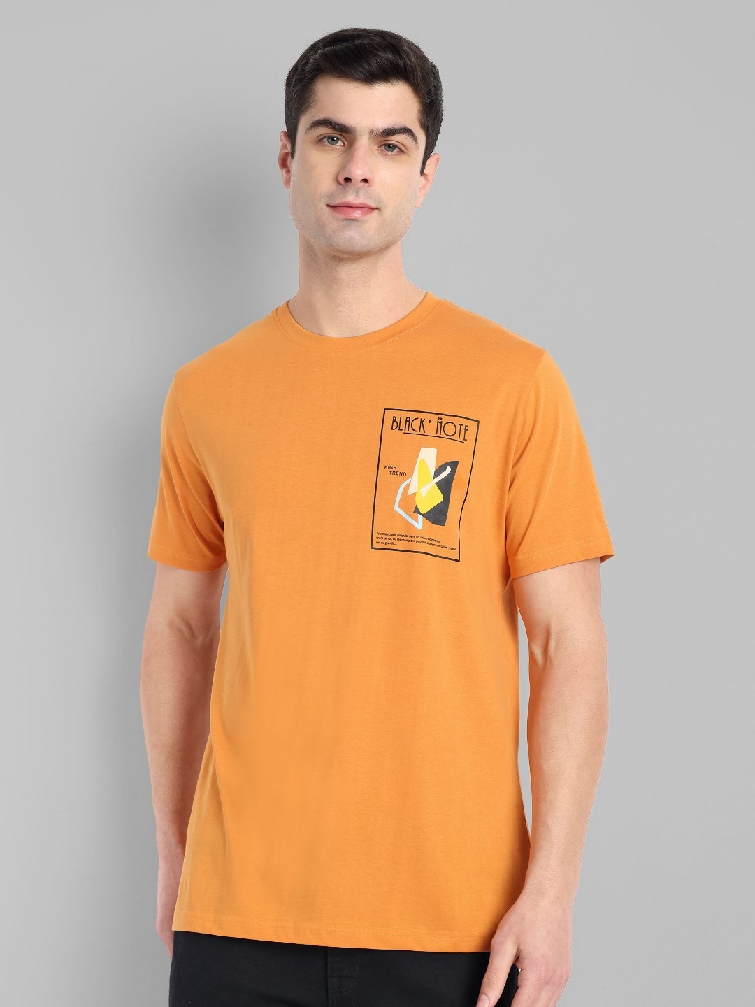 

TOMHIDDLE Men Typography Printed Round Neck T-shirt, Orange