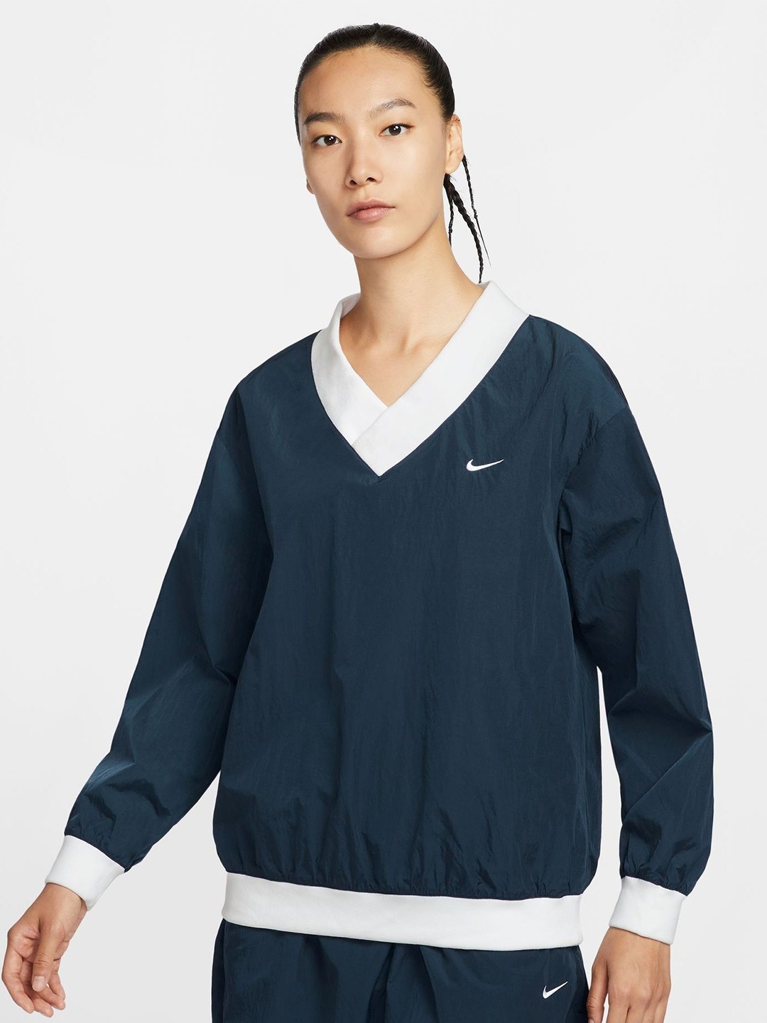 

Nike Sportswear Essential Women's Loose UV Woven Long-Sleeve V-Neck Top, Blue