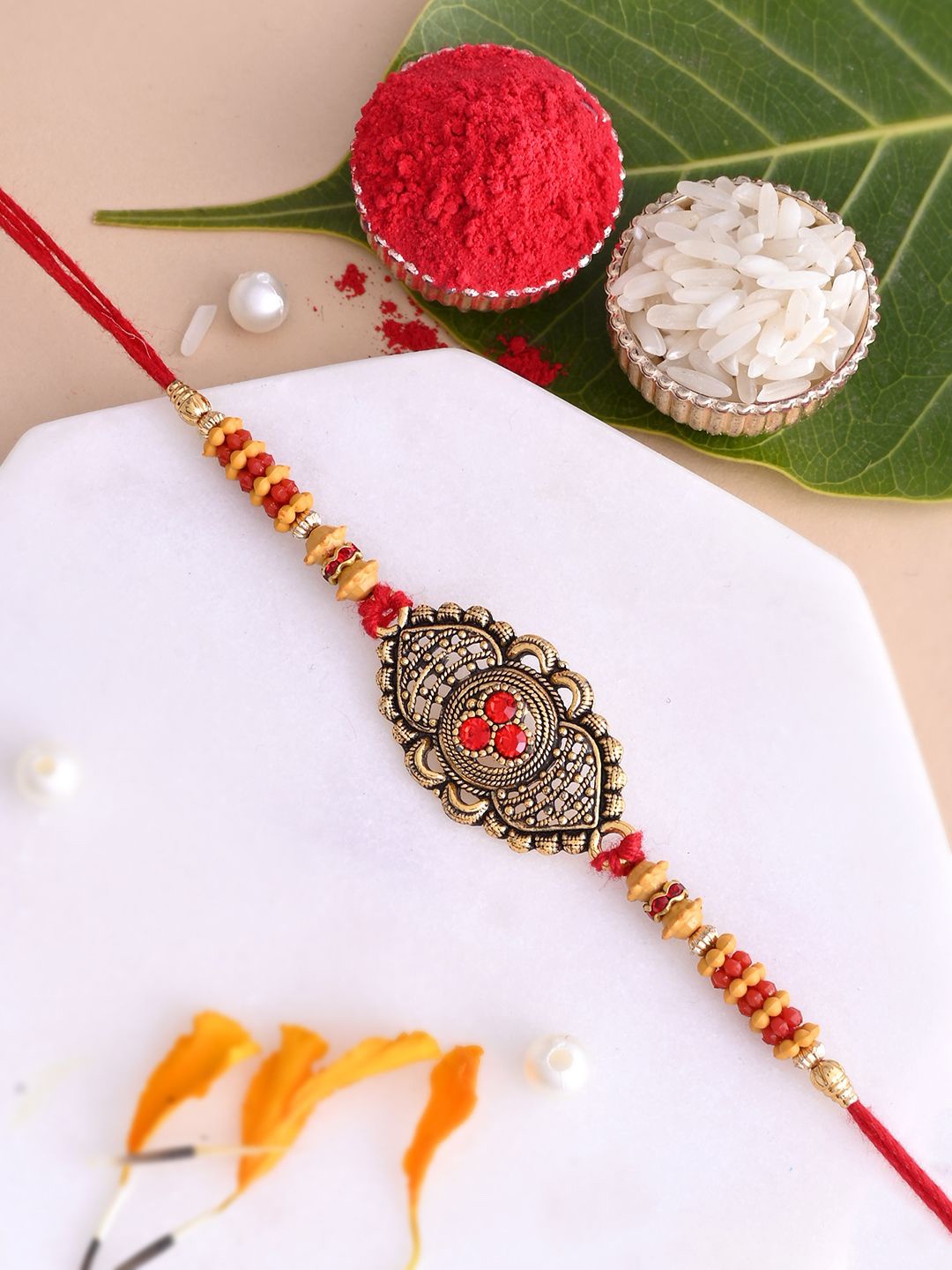 

Aapno Rajasthan Men Stones Studded Thread Rakhi With Roli Rice & Greeting Card, Gold