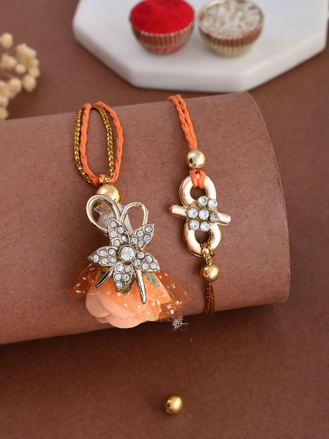 

Aapno Rajasthan Unisex Floral Beaded Bhaiya Bhabhi Thread Rakhi, Orange