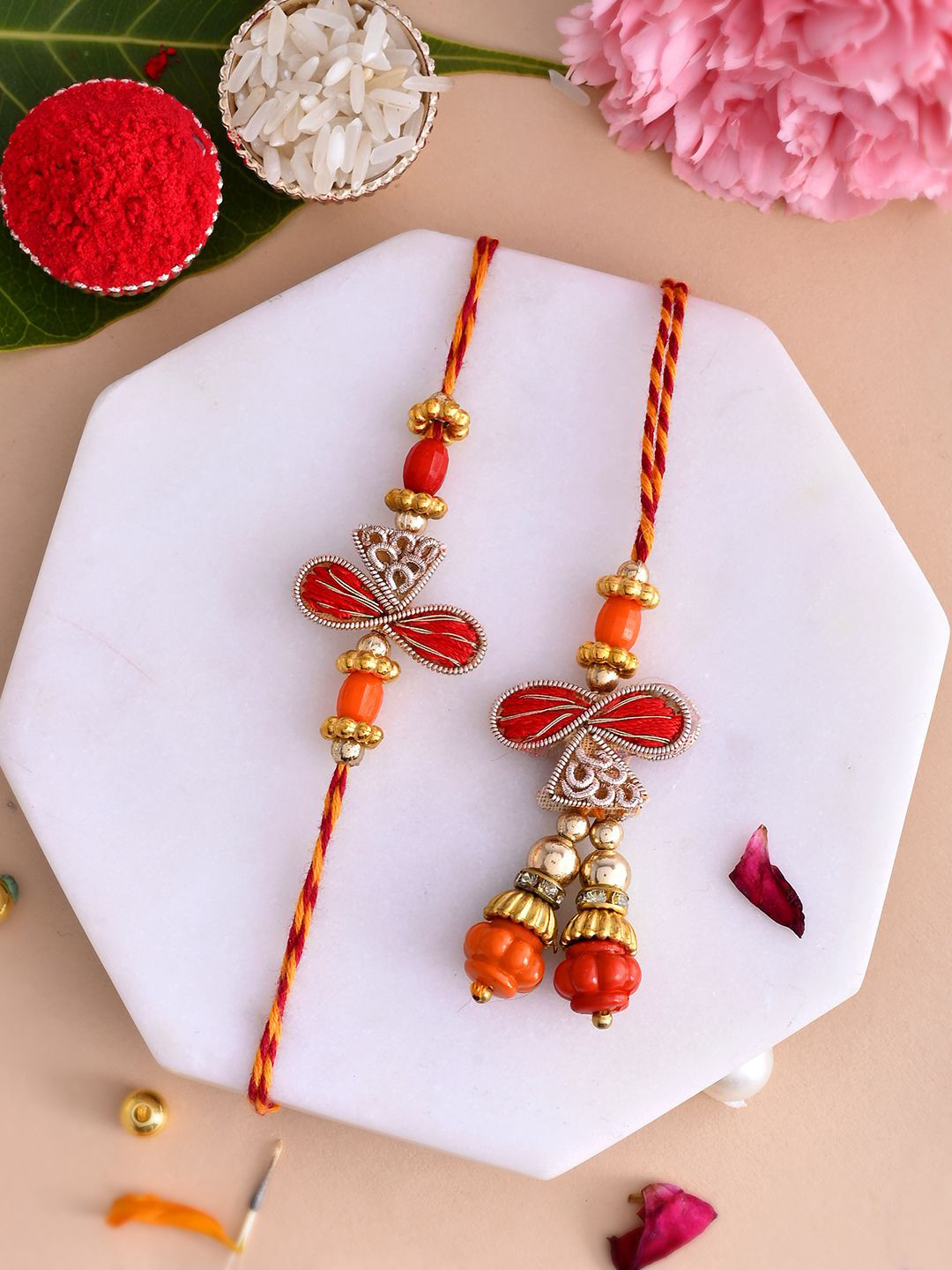 

Aapno Rajasthan Unisex Beaded Bhaiya Bhabhi Thread Rakhi With Roli Rice & Greeting Card, Gold