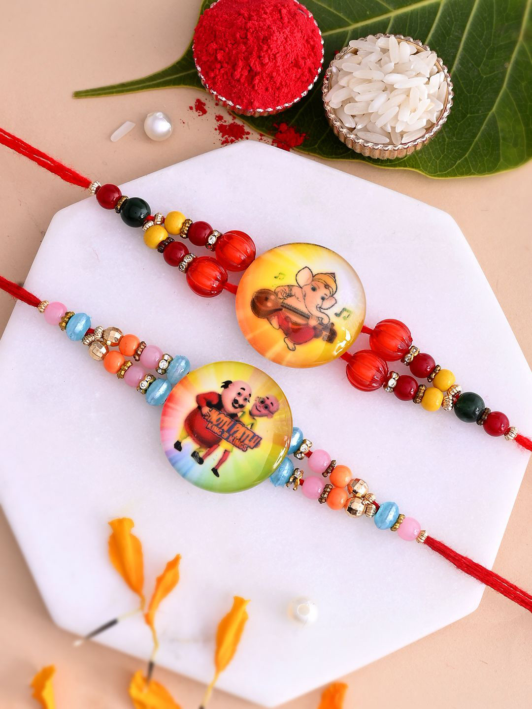 

Aapno Rajasthan Kids Ganesha & Motu Patlu Beaded Thread Rakhis, Yellow