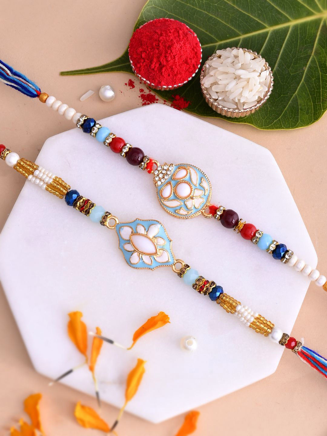 

Aapno Rajasthan Men Set Of 2 Beaded Thread Rakhis With Roli Rice & Greeting Card, White