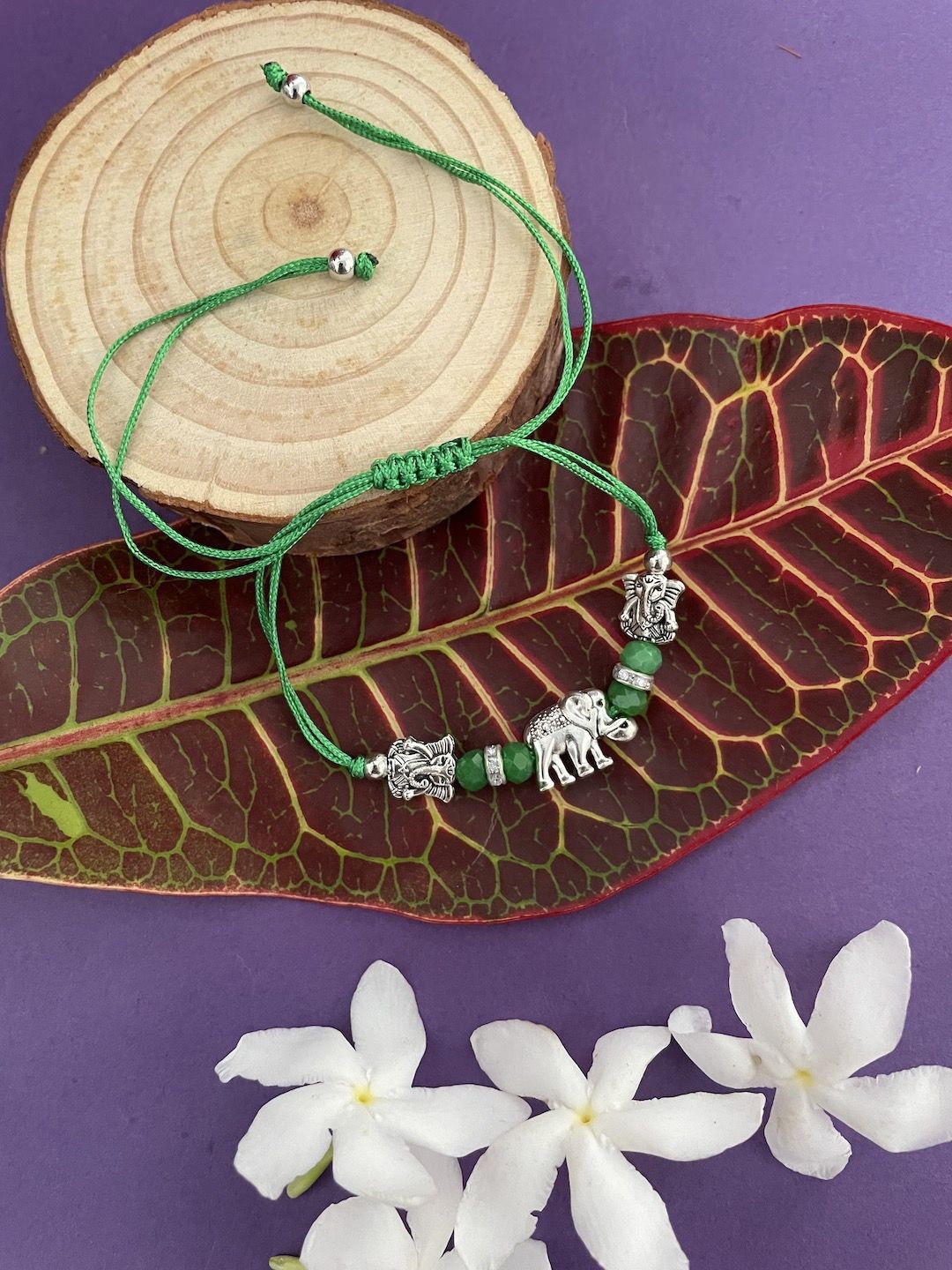 

Digital Dress Room Lord Ganesha Thread Rakhi, Green