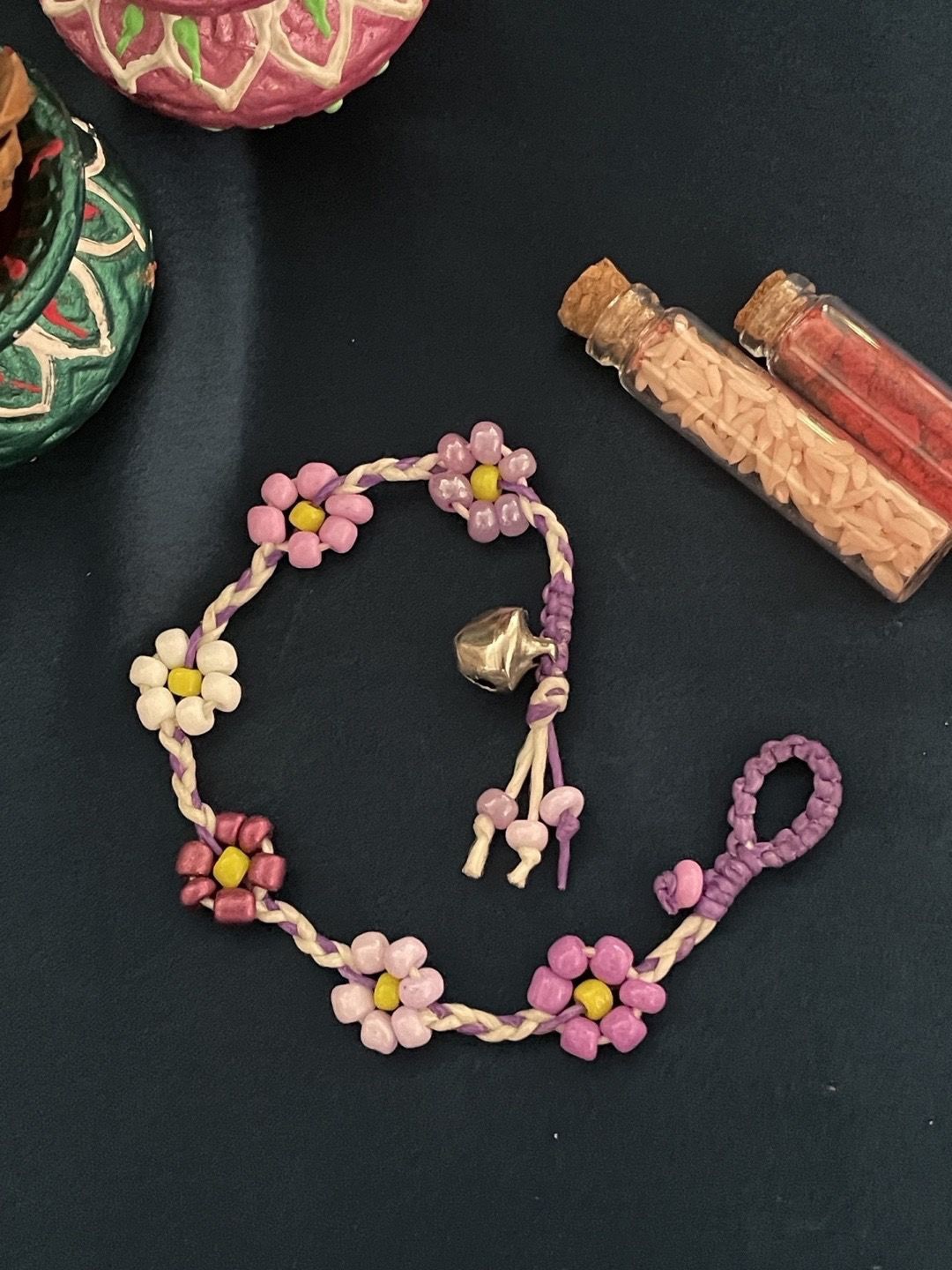

Digital Dress Room Ghungroo & Beaded Flower Thread Rakhi, Pink