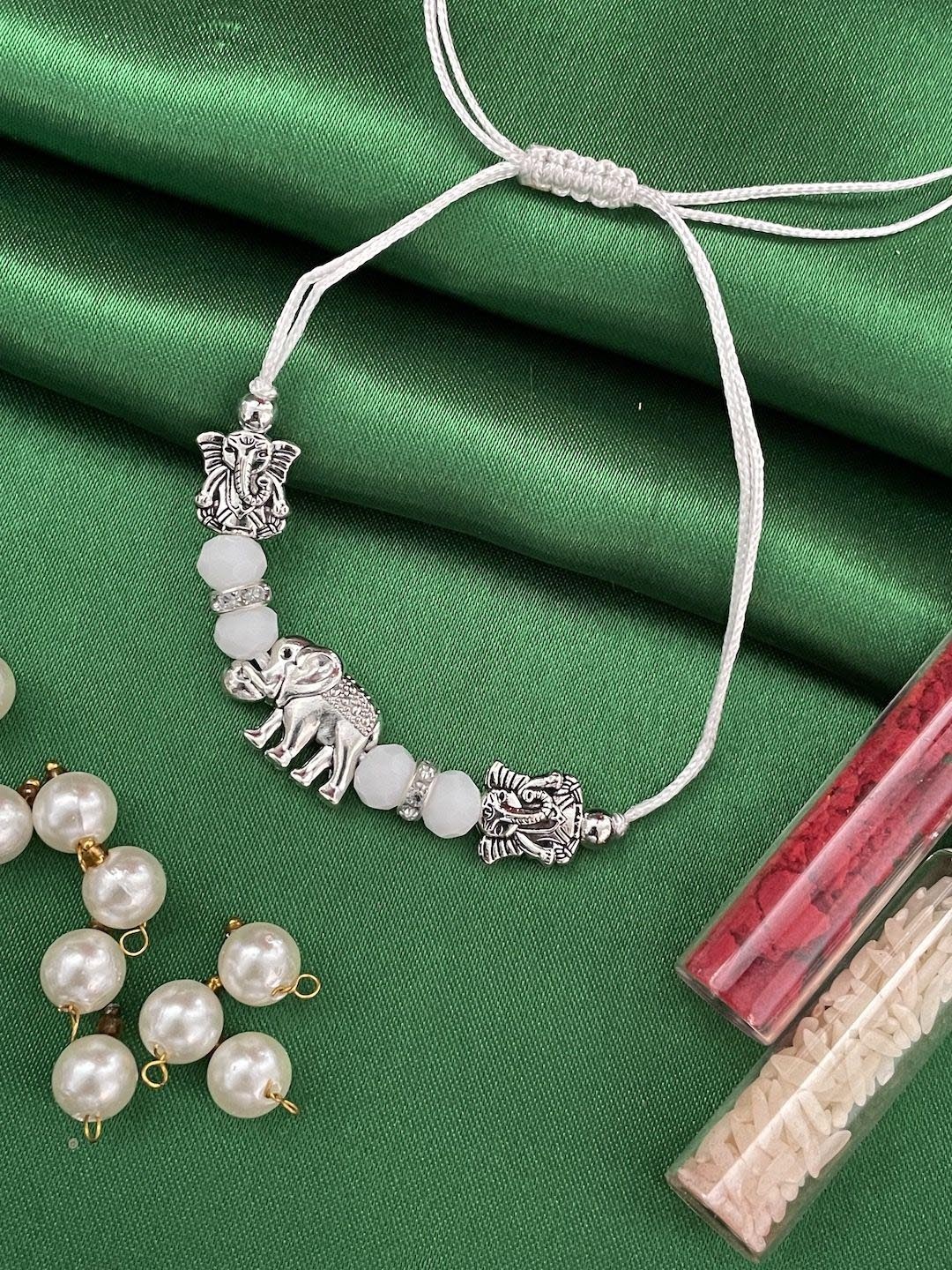 

Digital Dress Room Lord Ganesha Beaded Thread Rakhi, Silver