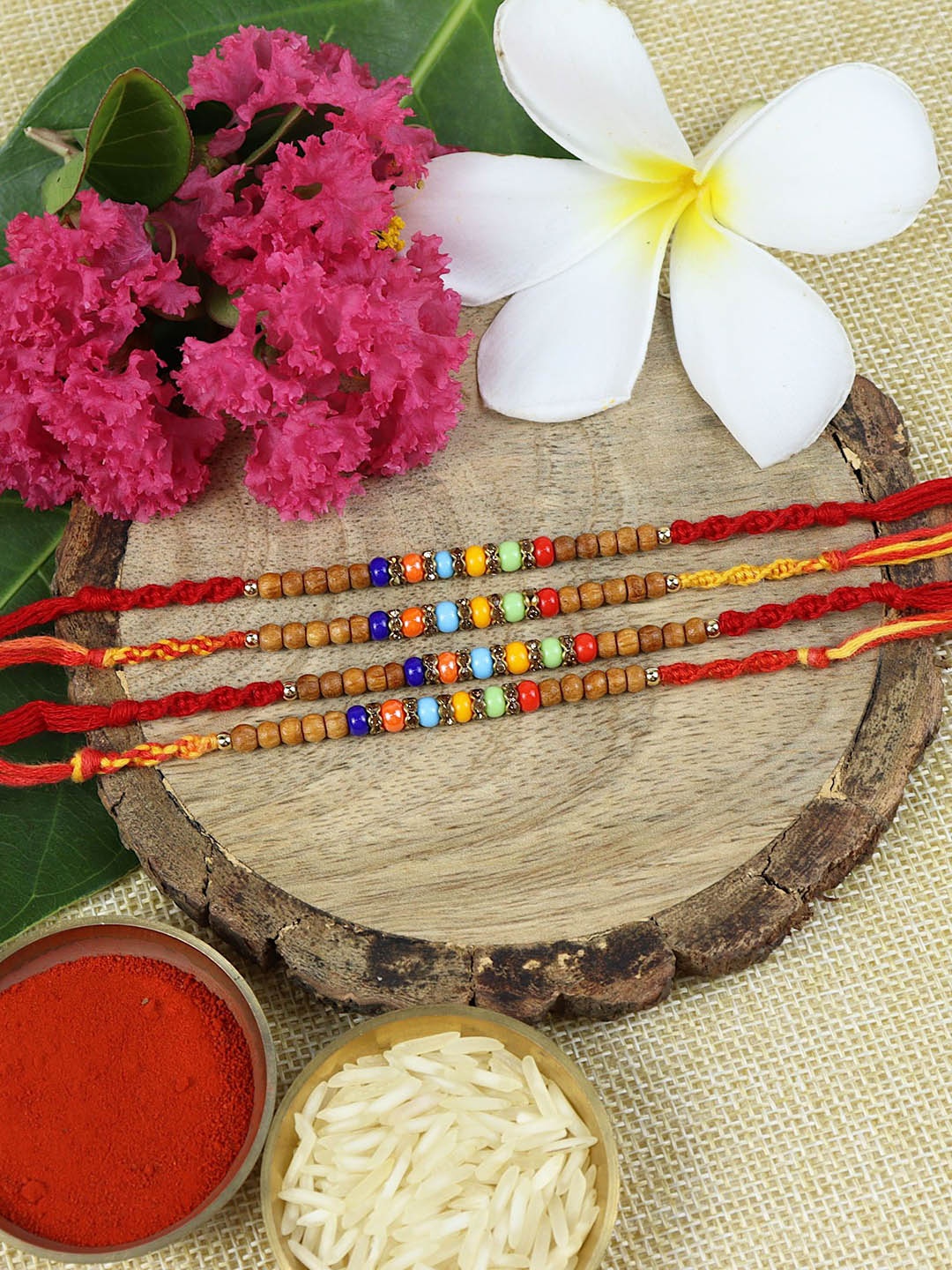 

Asthetika Set Of 4 Beaded Thread Rakhis With Roli Chawal, Red