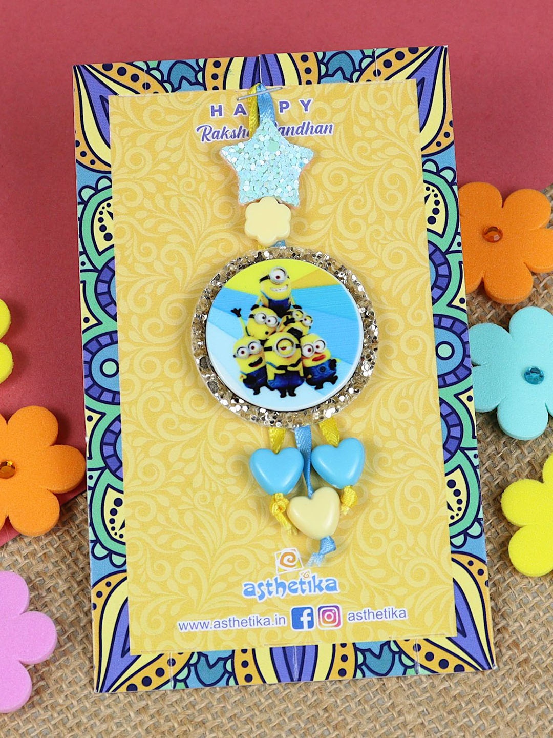 

Asthetika Minion Cartoon Lumba Rakhi With Roli Chawal, Blue