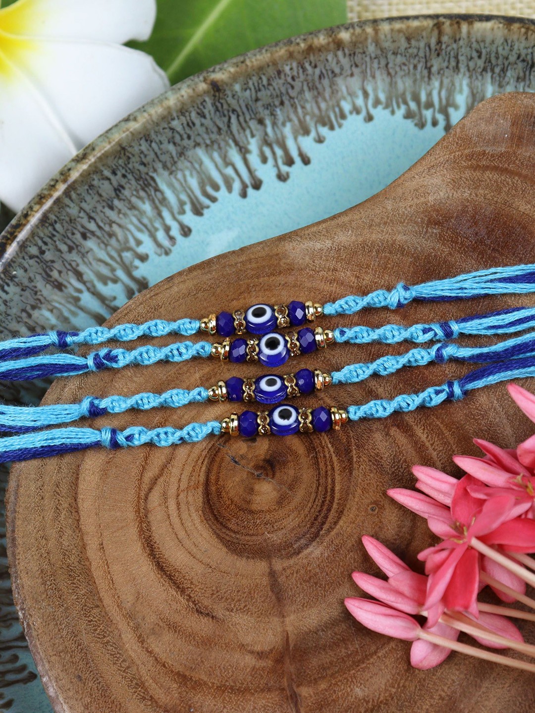 

Asthetika Set Of 4 Evil Eye Beaded Thread Rakhis With Roli Chawal, Blue