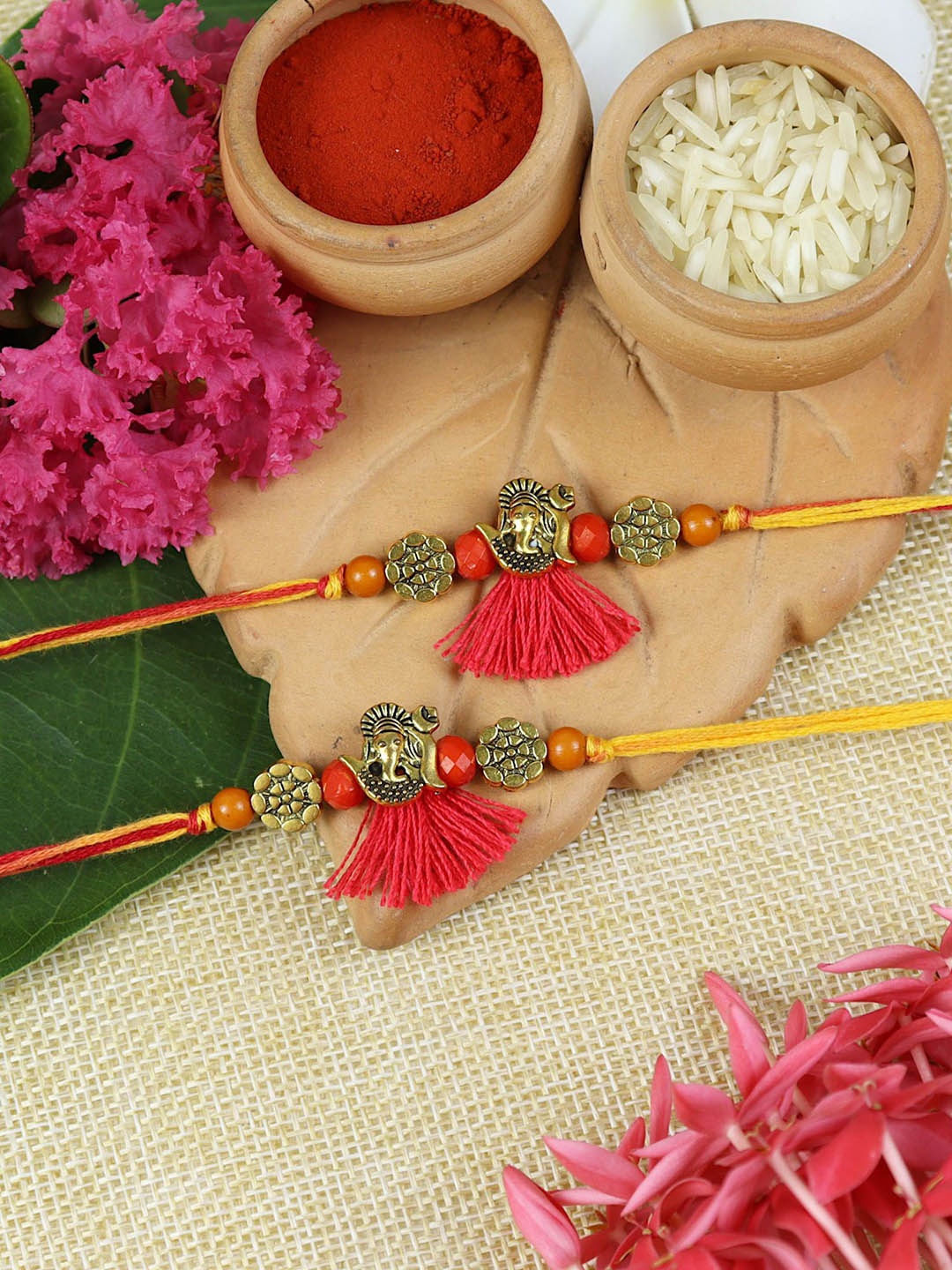 

Asthetika Set Of 2 Ganesha Charm Beaded Thread Rakhis With Roli Chawal, Red