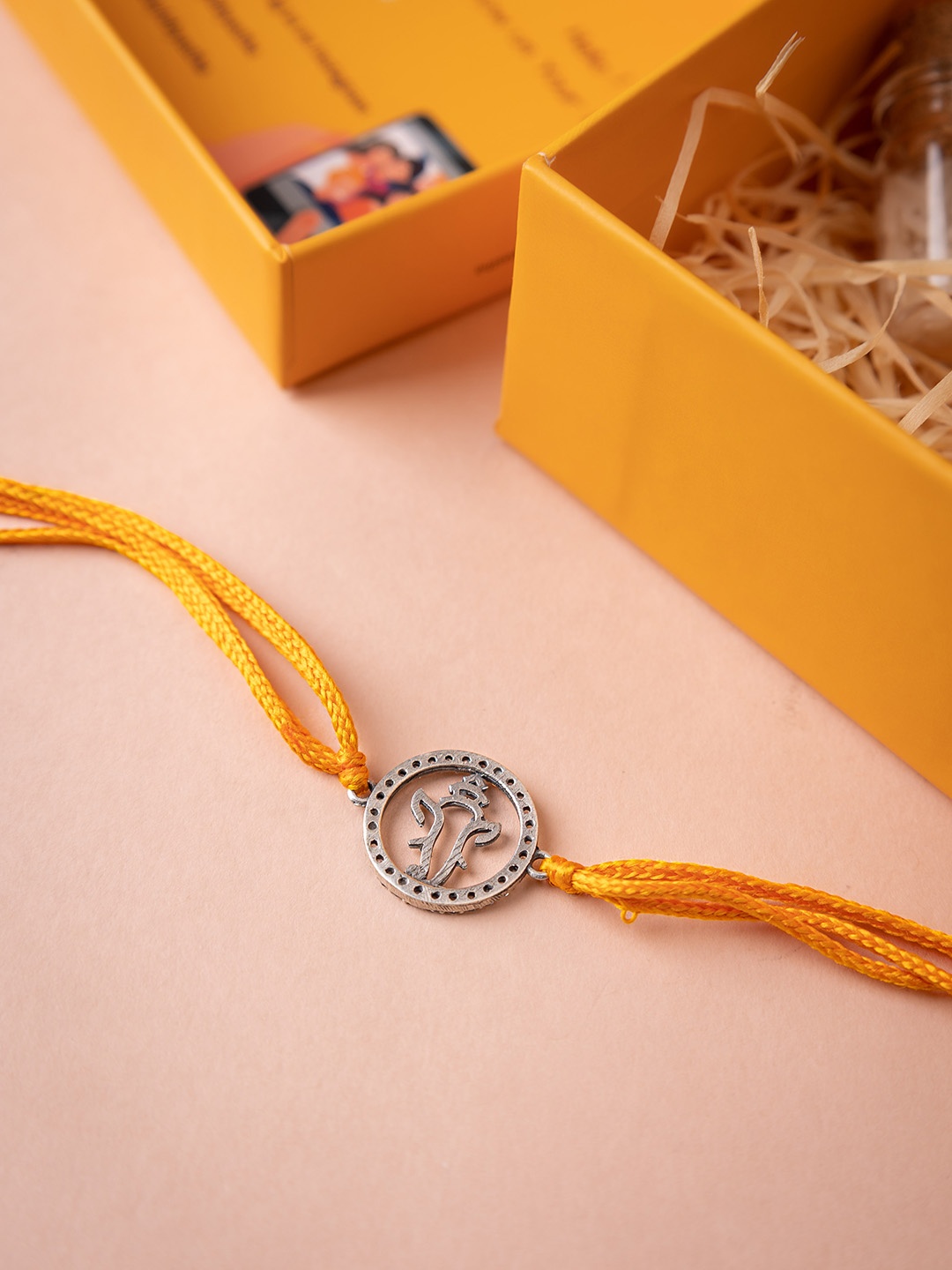 

Shyle 926 Sterling Silver Adya Ganesha Shubh Thread Rakhi