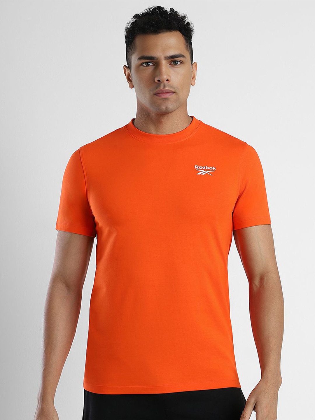 

Reebok Men Solid Round Neck Slim Fit T-Shirt, Orange