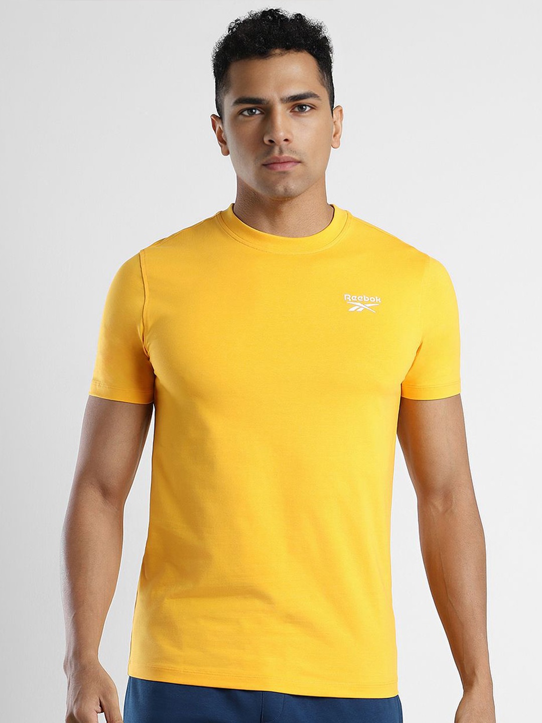 

Reebok Men Solid Round Neck Slim Fit T-Shirt, Yellow