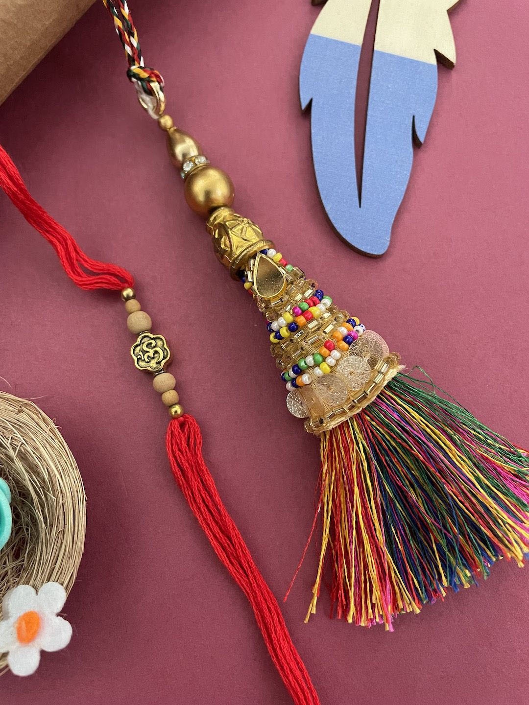 

Digital Dress Room Set Of 2 Om Designs & Tassel Lumba Rakhi, Gold