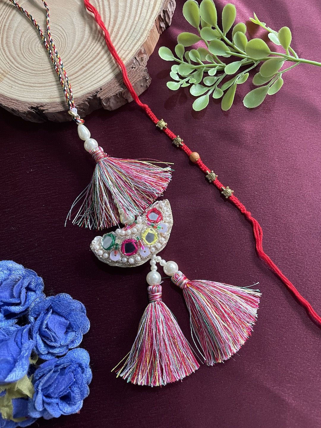 

Digital Dress Room Set Of 2 Pearl Beaded Lumba Thread Rakhis With Roli Chawal, Red