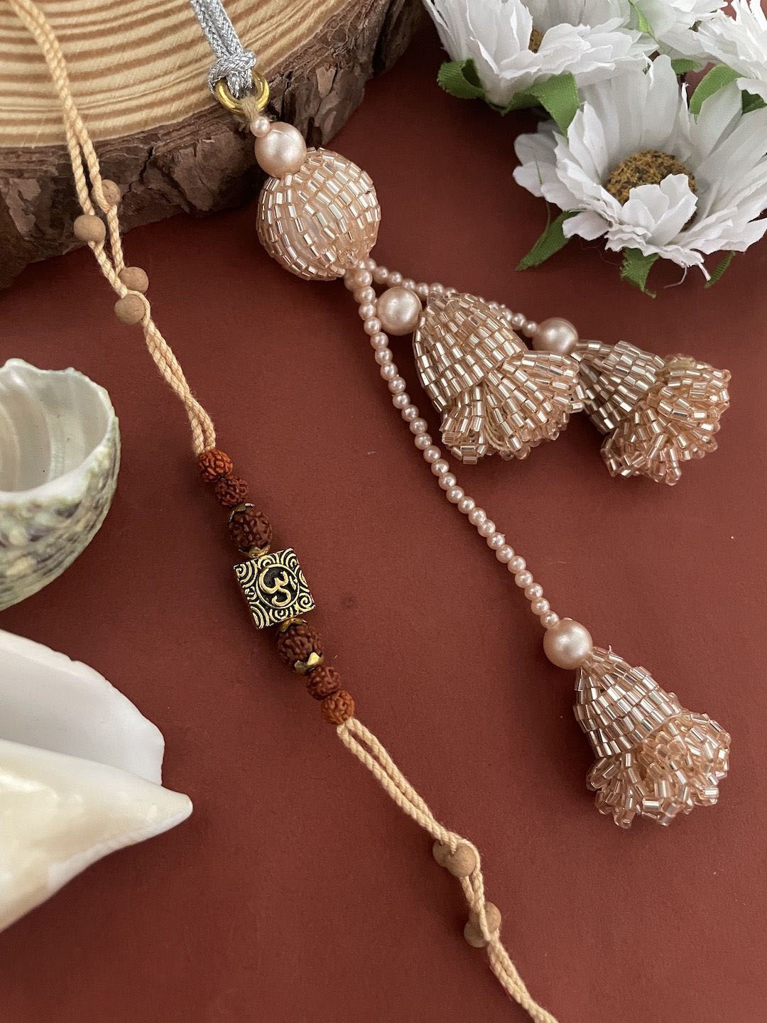 

Digital Dress Room Set Of 2 Om Beaded Lumba Thread Rakhis With Roli Chawal, Gold