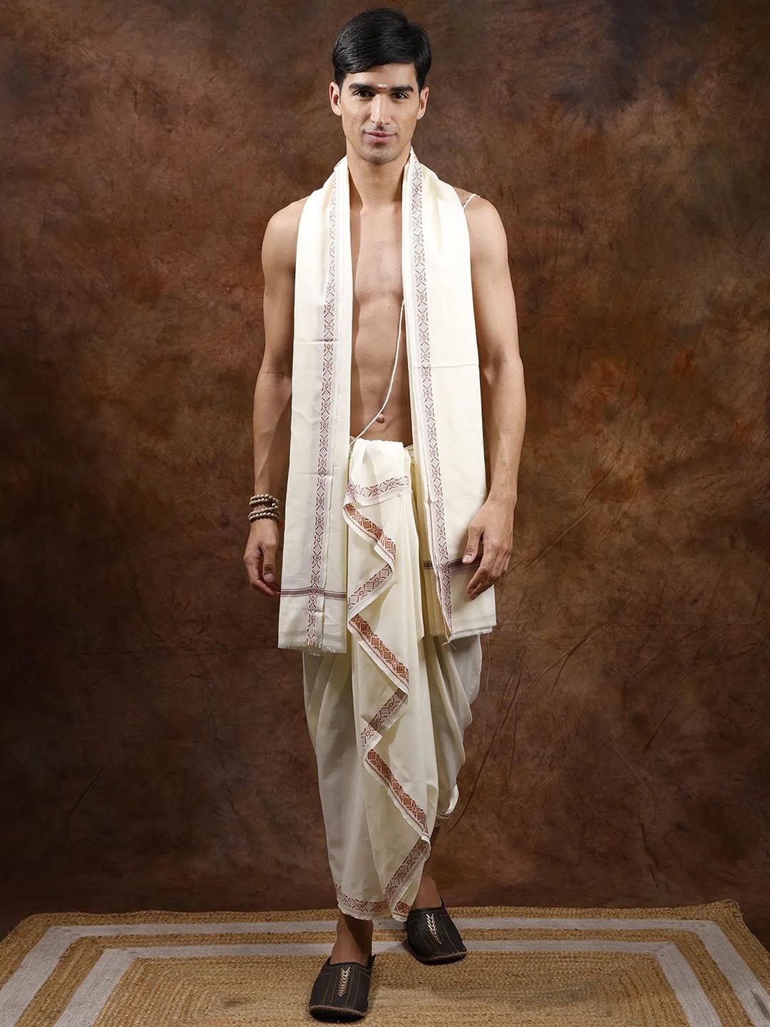 

Exotic India Cannoli Cream Plain Dhoti and Angavastram Set with Woven Border