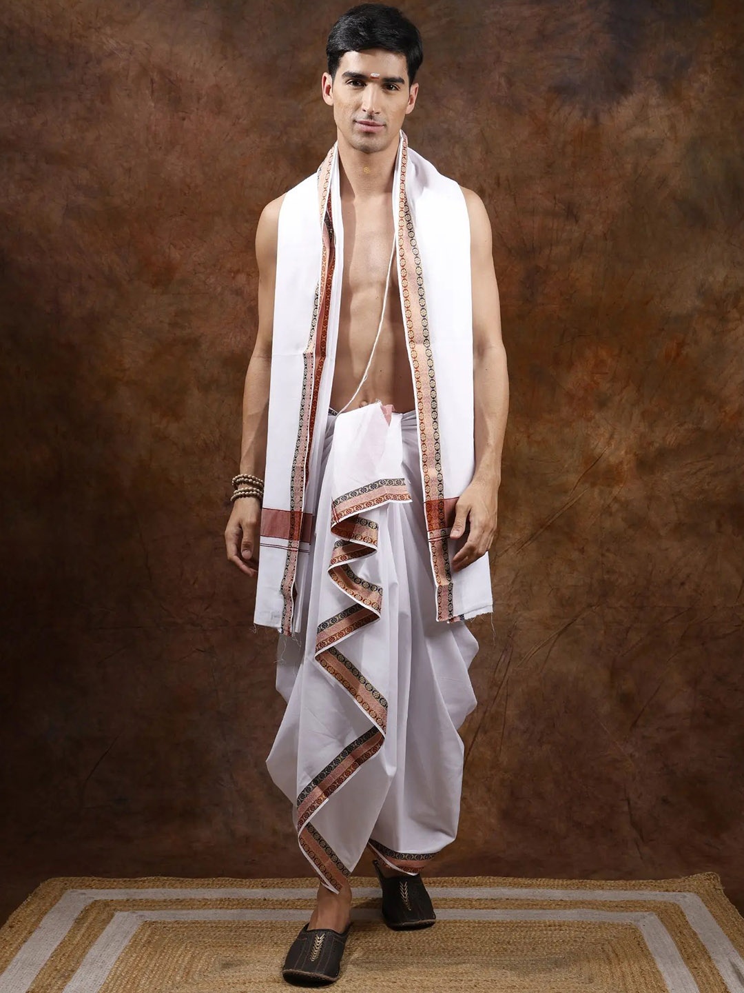 

Exotic India Old Rose Pure Cotton Dhoti with Angavastram Set and Golden Zari Woven Border, White