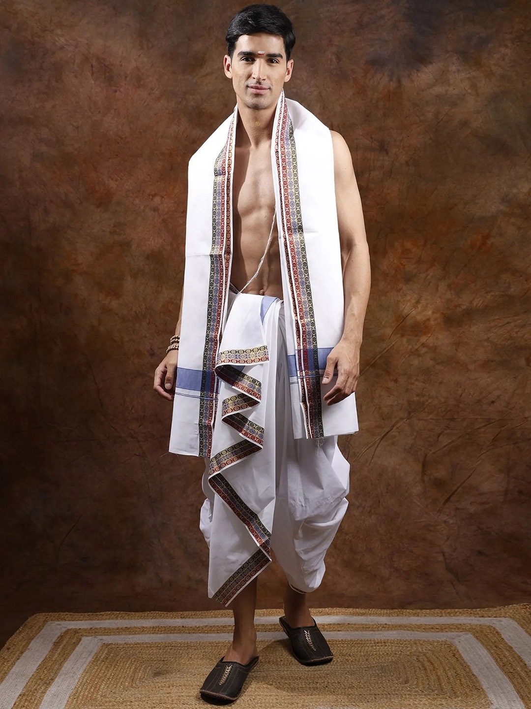 

Exotic India Nebulas Blue Pure Cotton Dhoti with Angavastram Set and Zari Woven Border, White