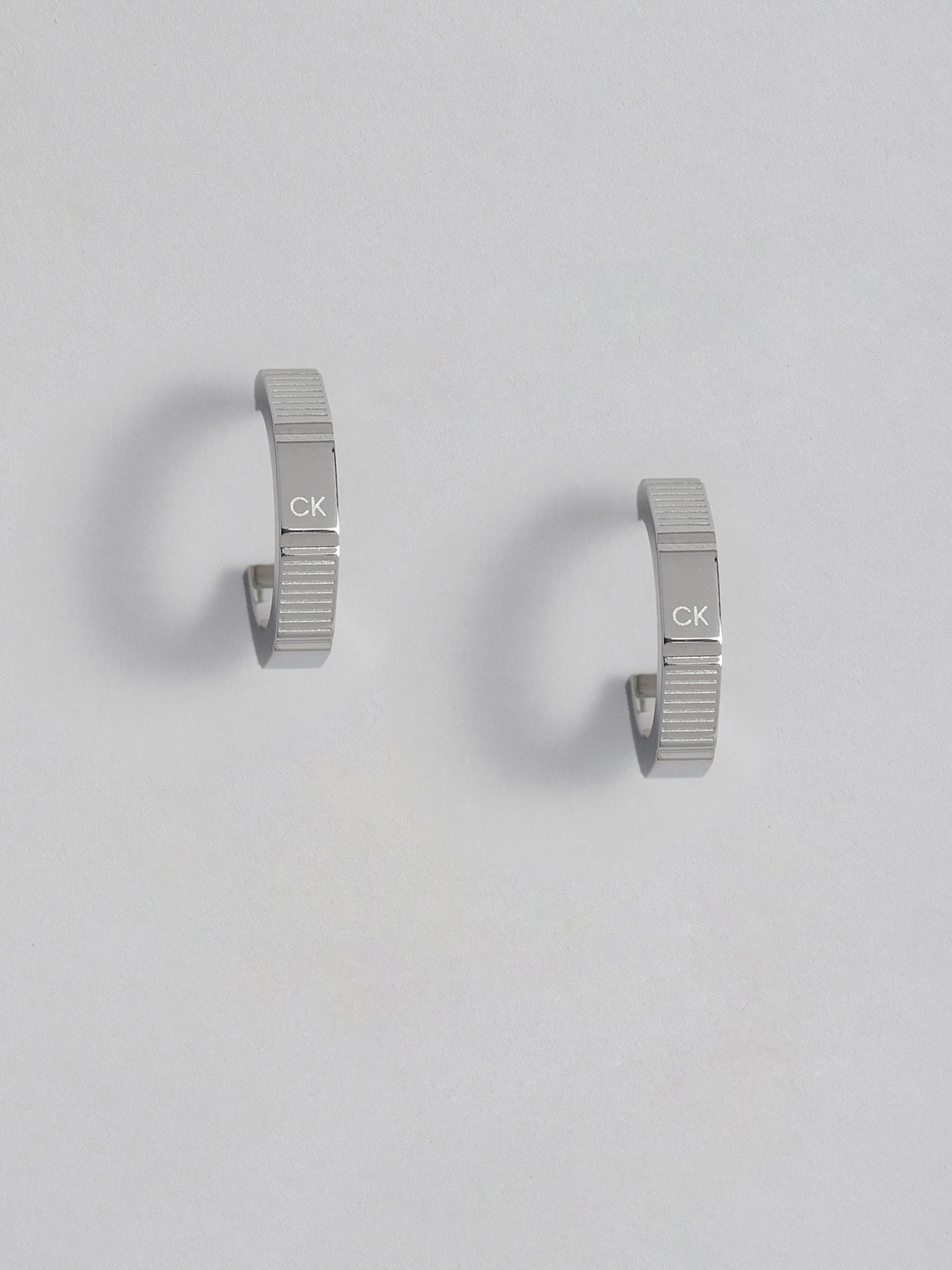 

Calvin Klein Essentials Unisex Stainless Steel Classic Studs Earrings, Silver