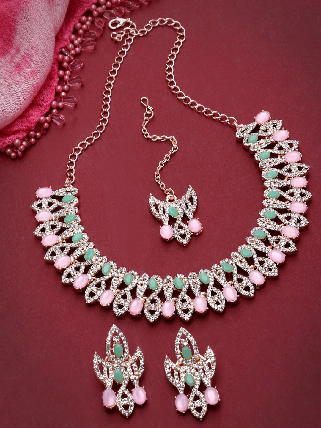 

Sukkhi Rose Gold Plated Kundan & AD Stone Studded Jewellery Set