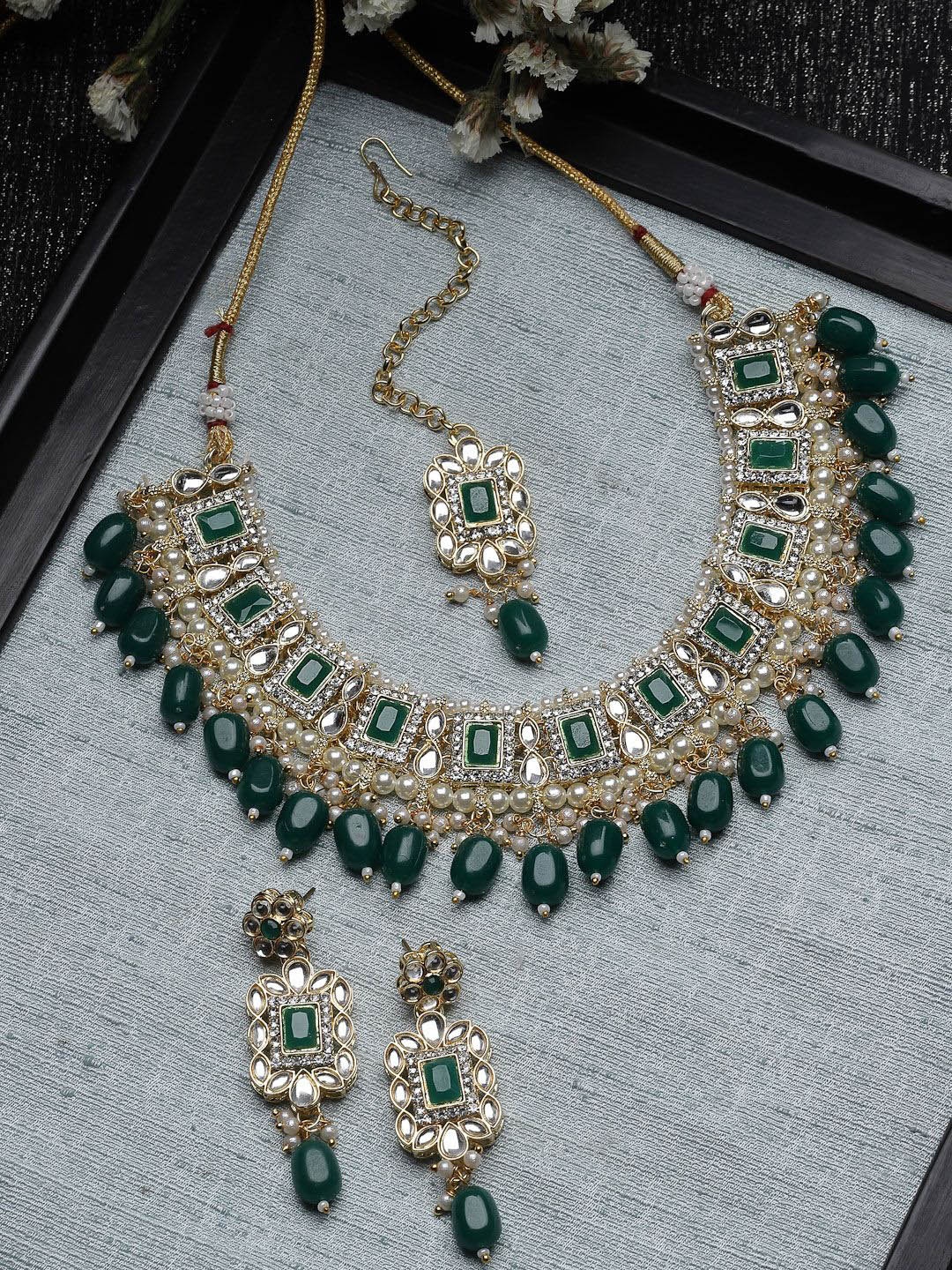 

Sukkhi Gold Plated American Diamond Studded & Beaded Jewellery Set