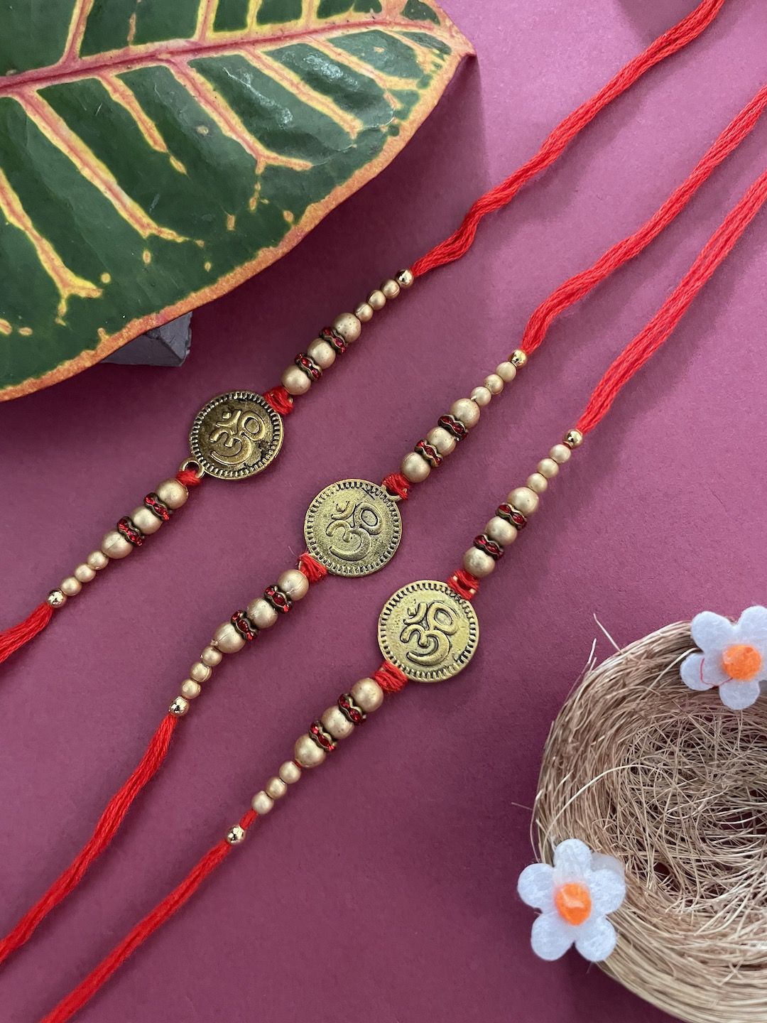 

Digital Dress Room Set Of 3 OM Coins Thread Rakhi, Red