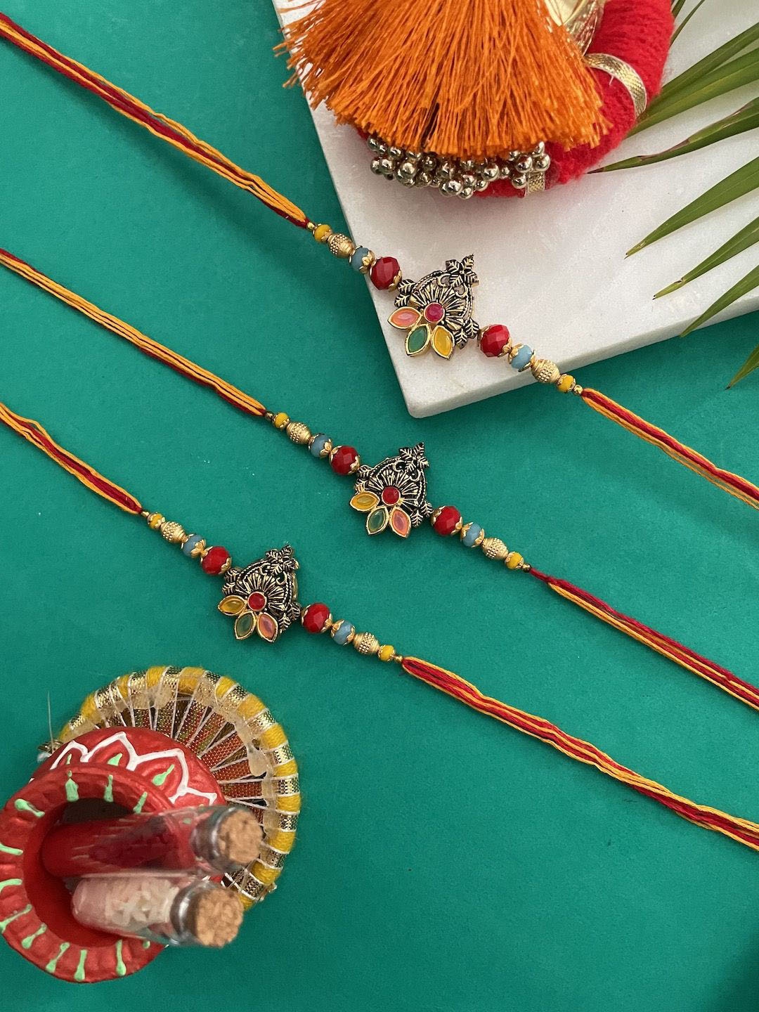 

Digital Dress Room Set Of 3 Flower Thread Rakhi, Red