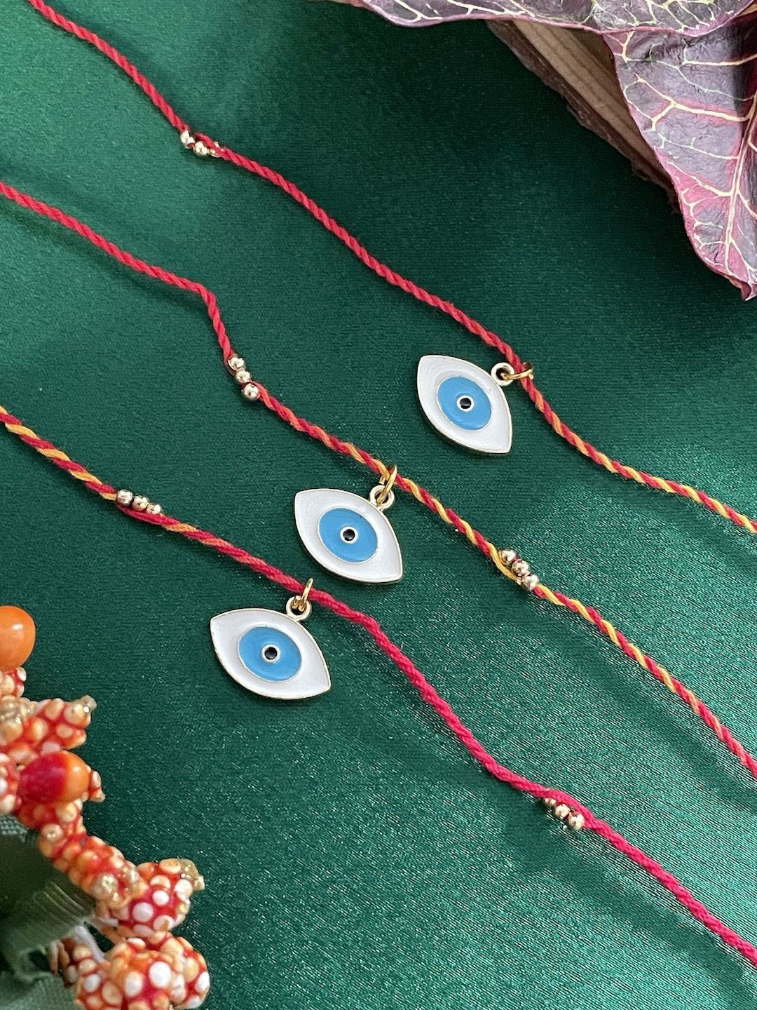 

Digital Dress Room Set Of 3 Evil Eye Charm Thread Rakhi, Red