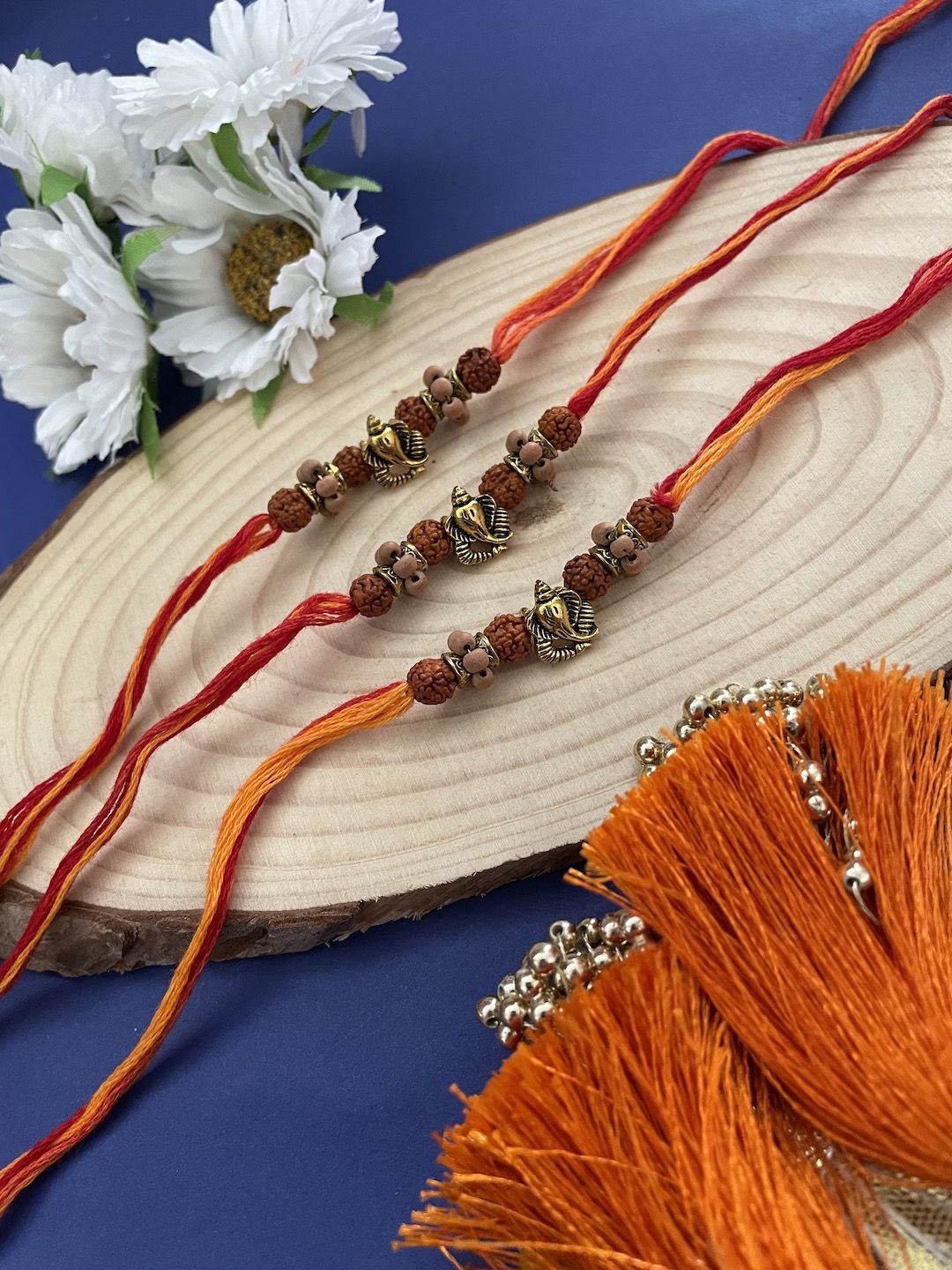 

Digital Dress Room Set Of 3 Ganesha & Rudraksha Thread Rakhis With Roli Chawal, Red