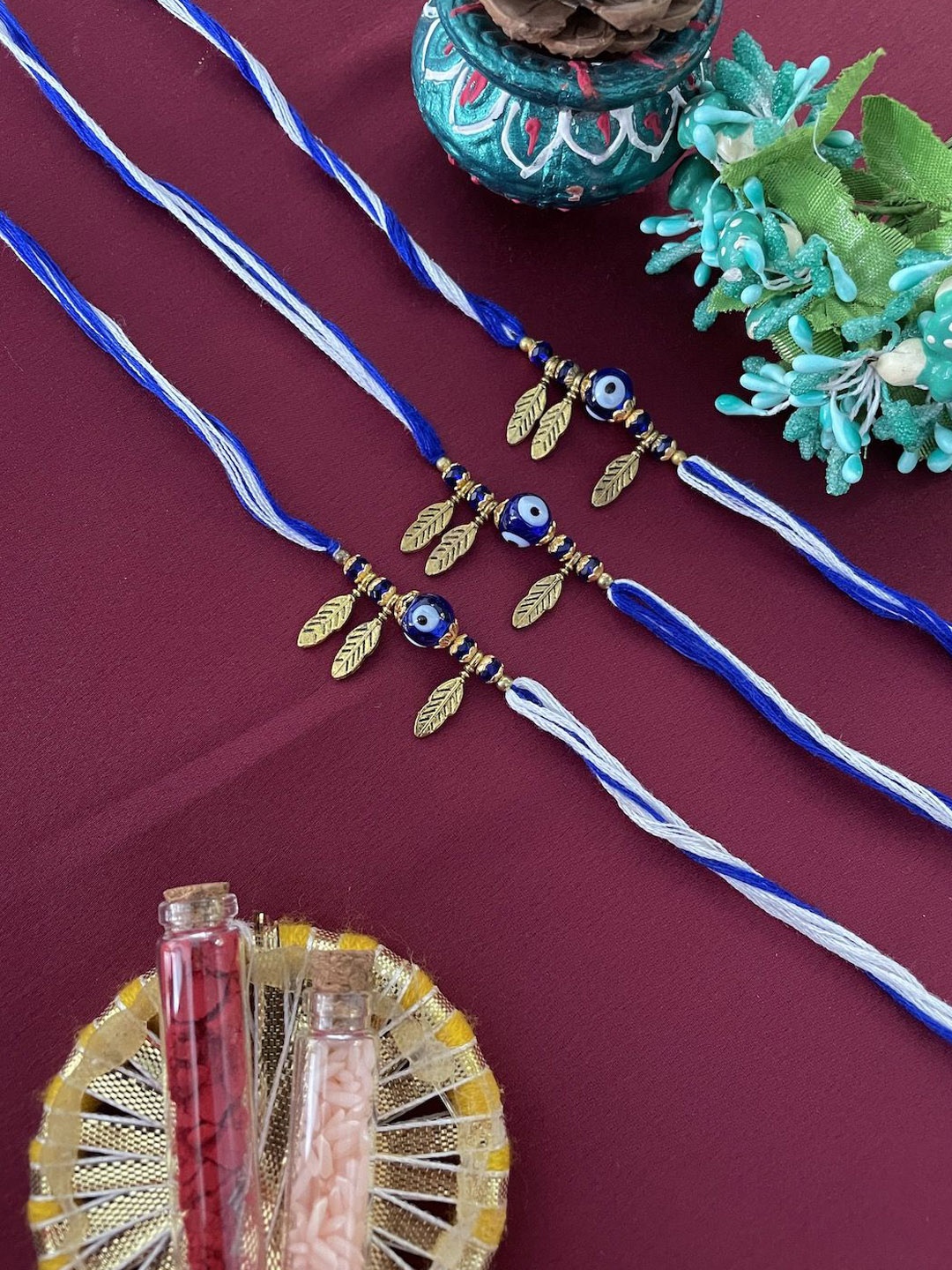 

Digital Dress Room Set of 3 Beaded Thread Rakhis, Blue