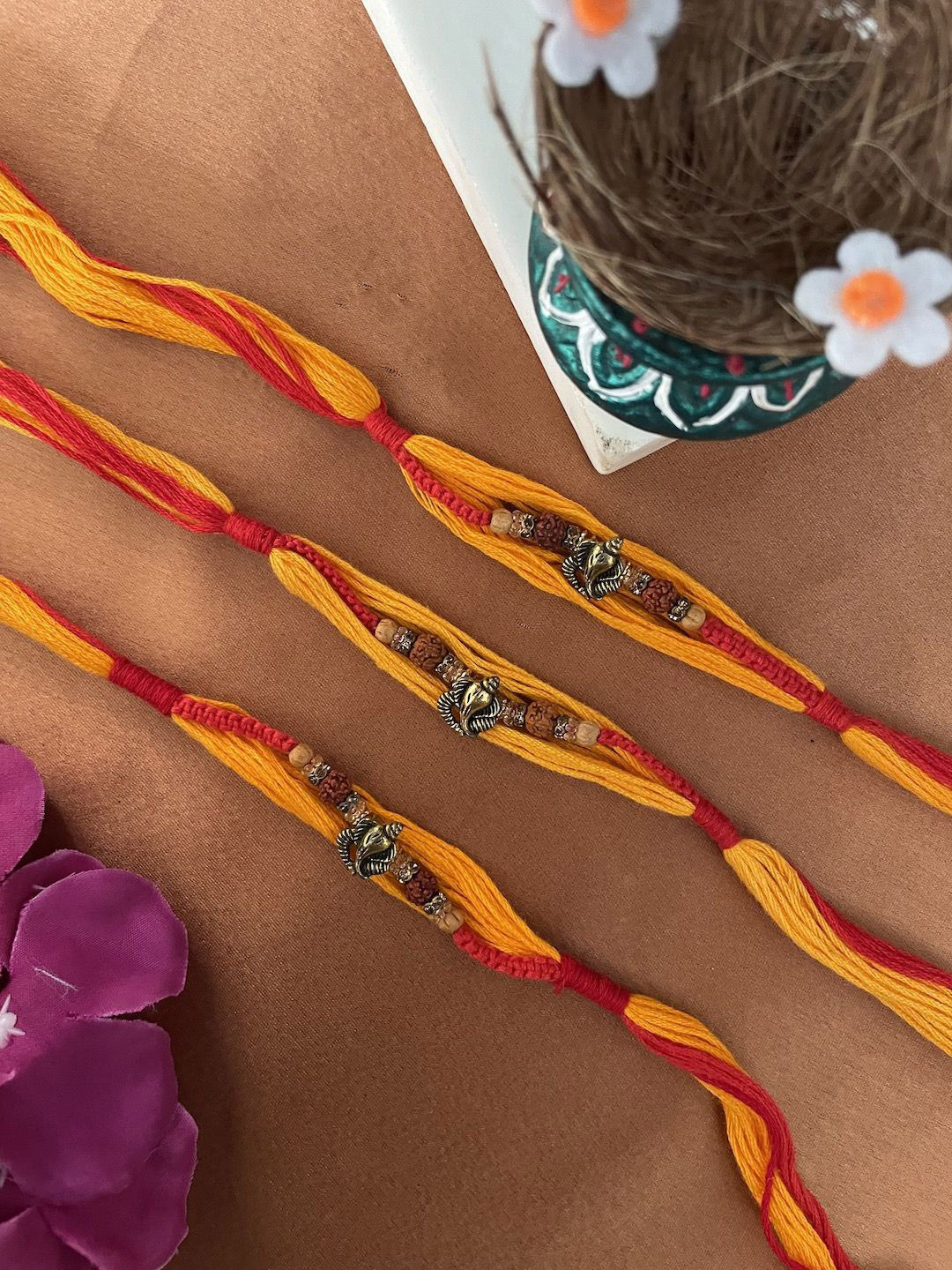 

Digital Dress Room Set of 3 Beaded Thread Rakhis, Yellow