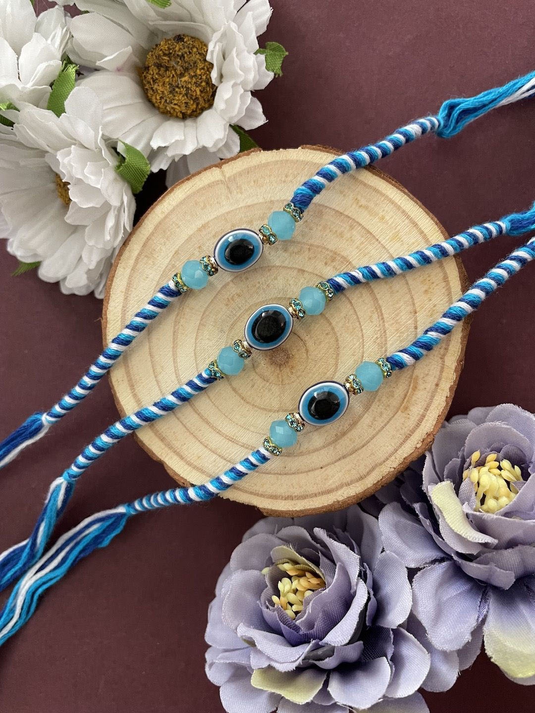 

Digital Dress Room Set of 3 Beaded Thread Rakhis, Blue
