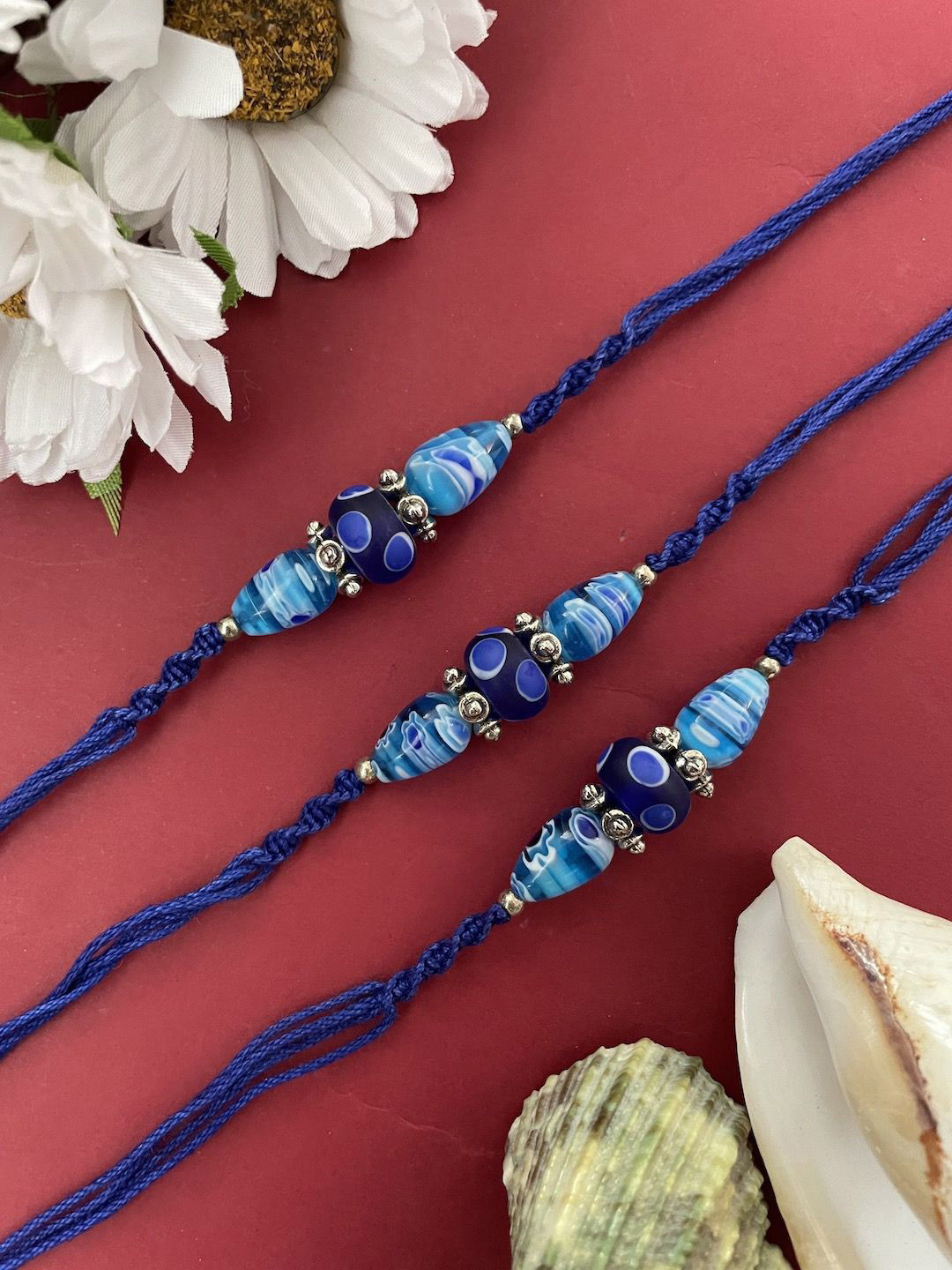 

Digital Dress Room Set Of 3 Beaded Thread Rakhis, Blue