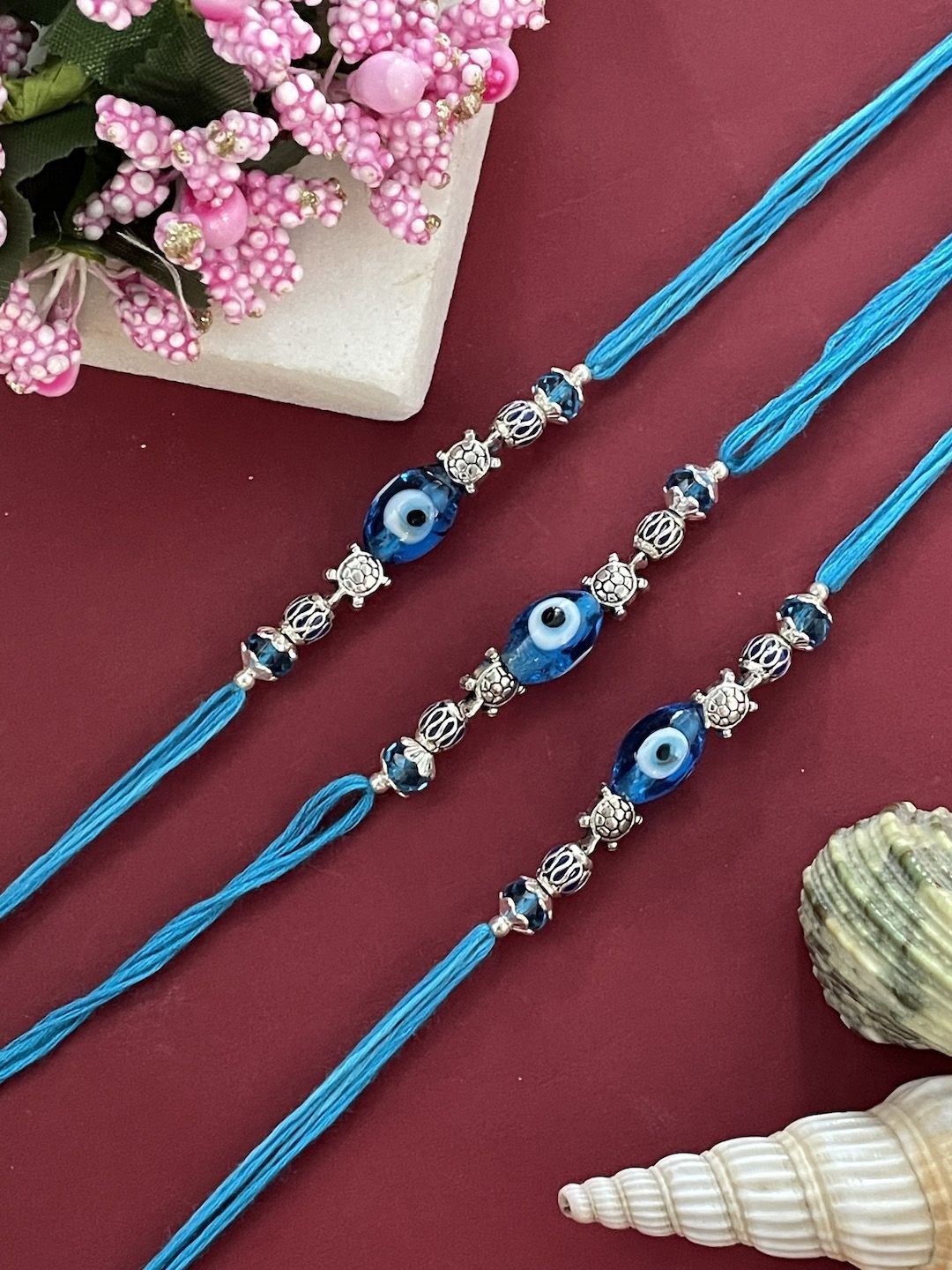 

Digital Dress Room Set Of 3 Beaded Thread Rakhis, Blue