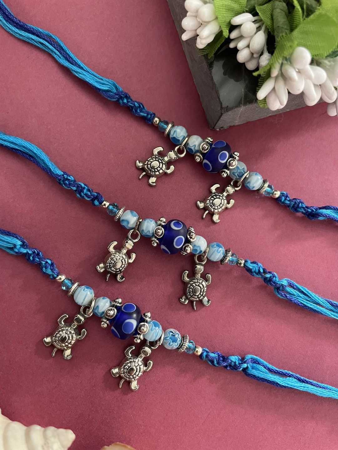 

Digital Dress Room Set Of 3 Beaded Thread Rakhis, Blue