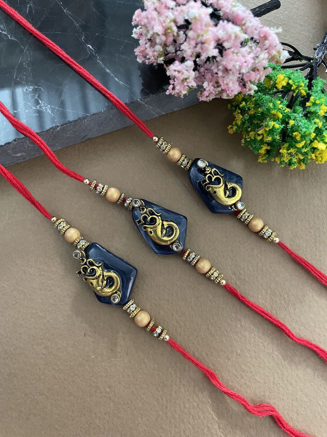 

Digital Dress Room Set of 3 Ganesh Beaded Thread Rakhi, Red