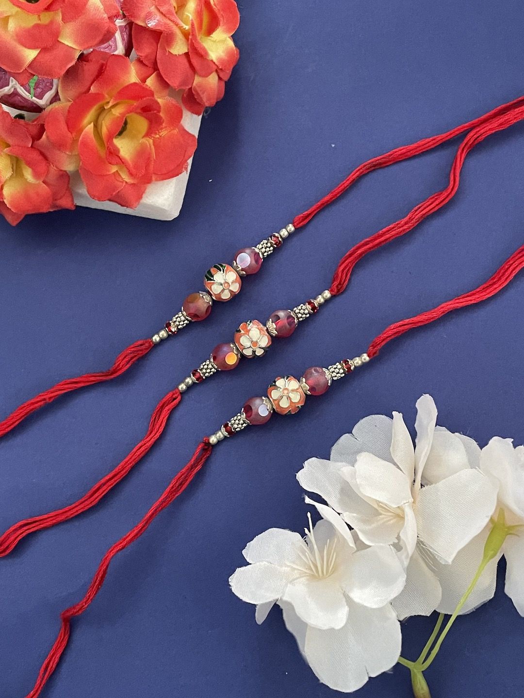 

Digital Dress Room Set of 3 Beaded Thread Rakhi, Red