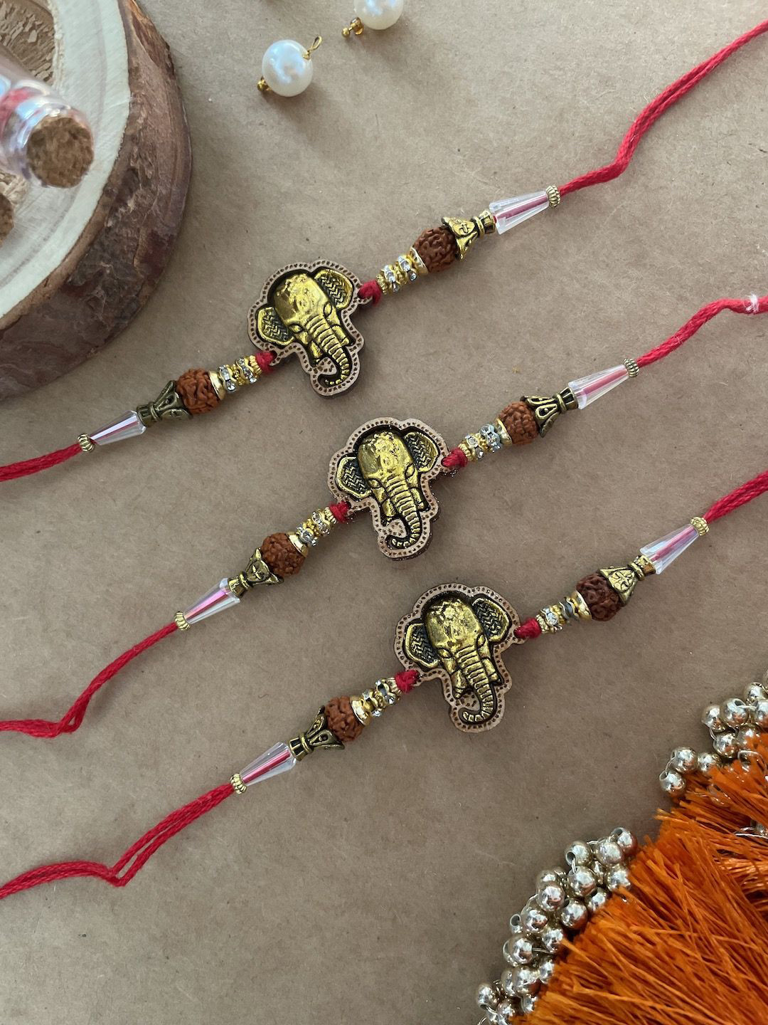 

Digital Dress Room Set of 3 Ganesh Beaded Thread Rakhi, Red